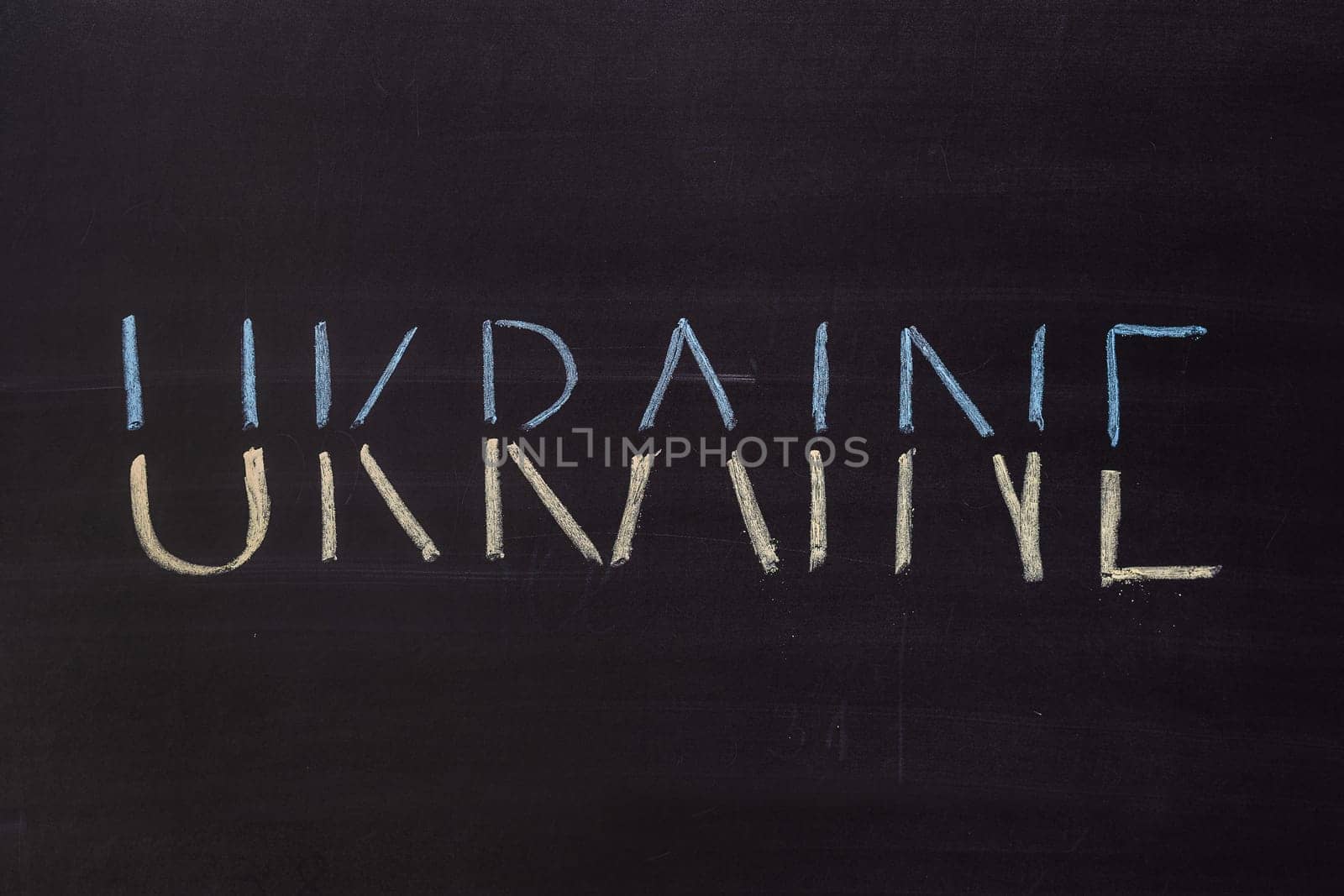 Word "Ukraine"" writed on blackboard with chalk"