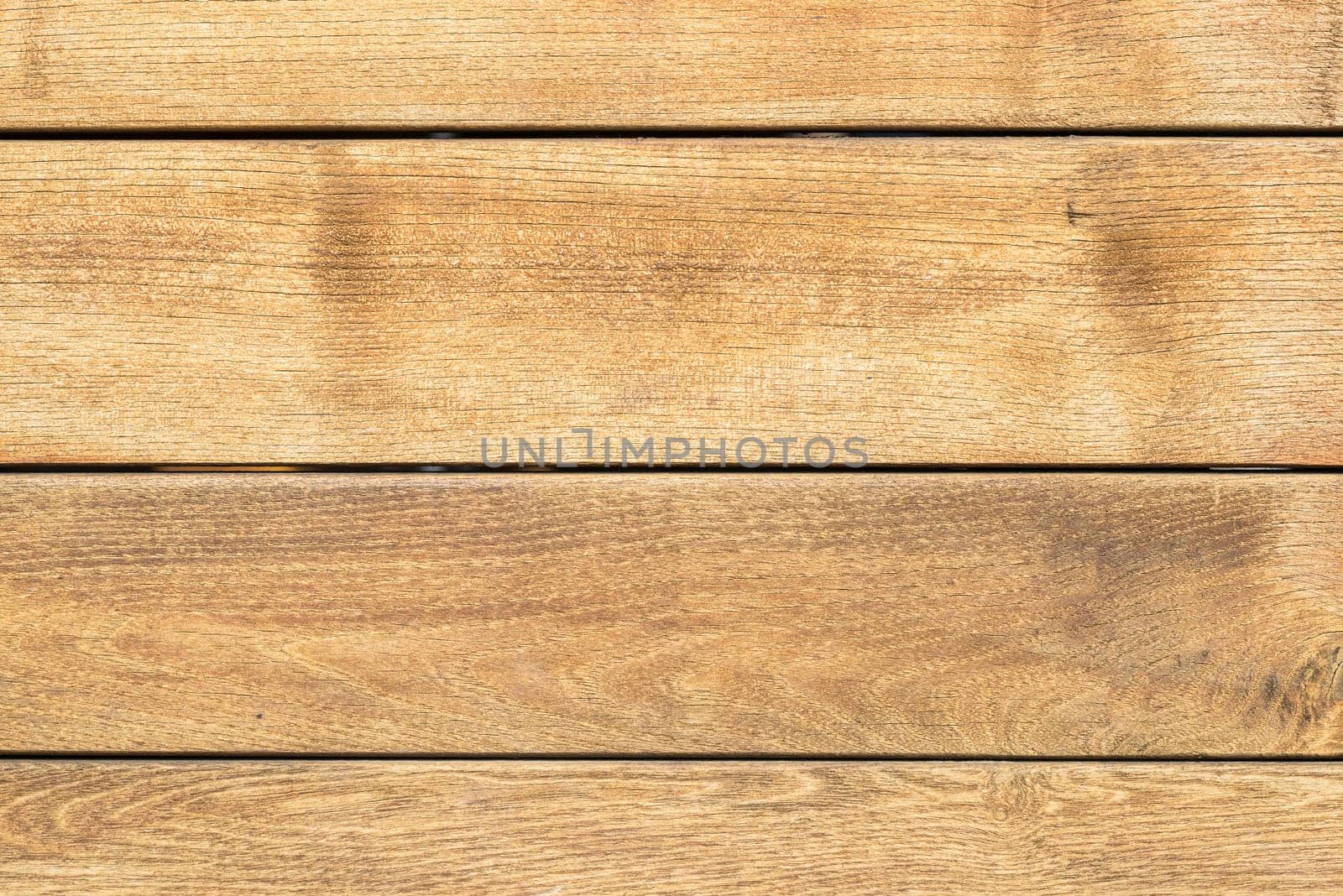 Brown wall made of individual wooden boards