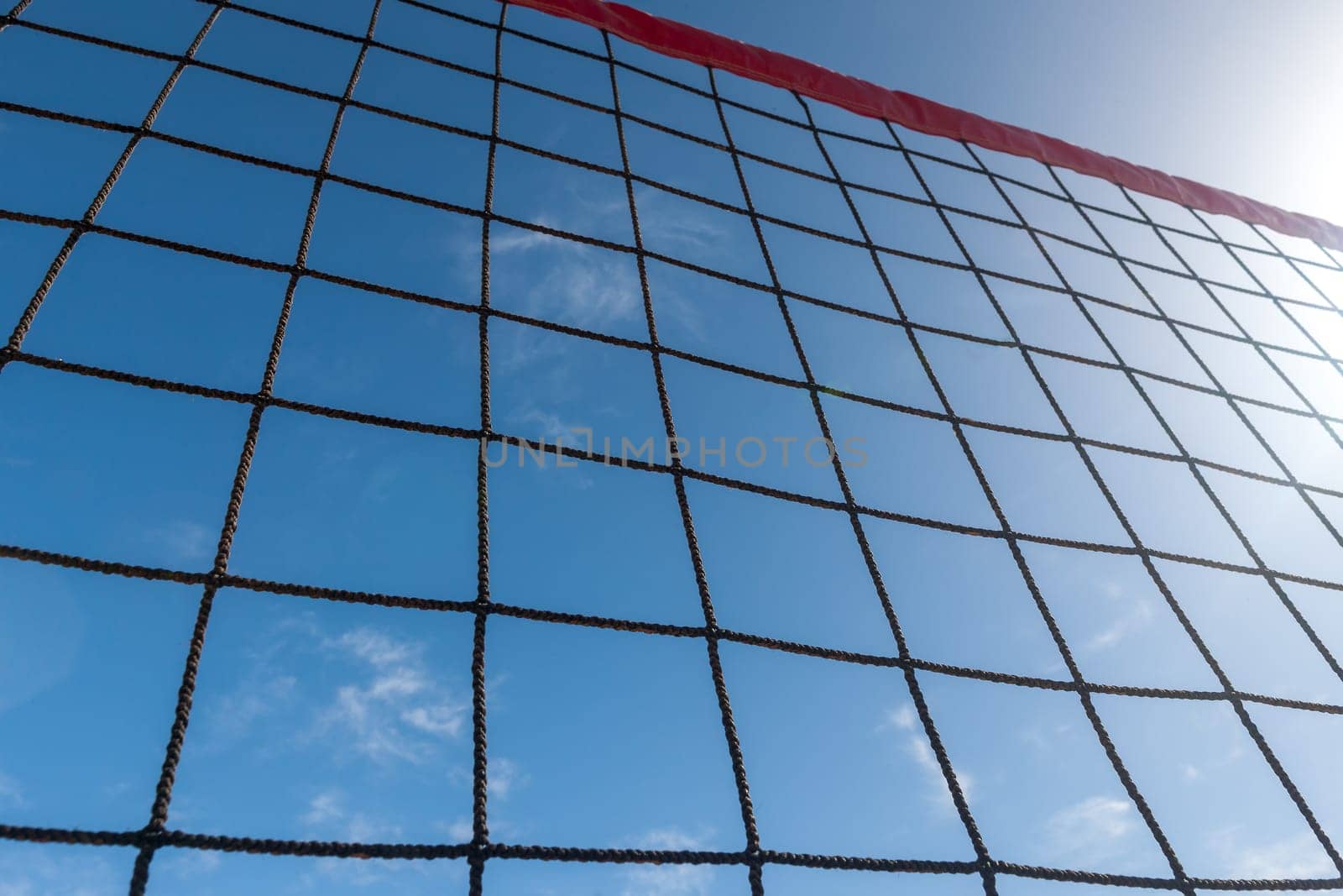 volleyball net on a background blue sky and clouds
