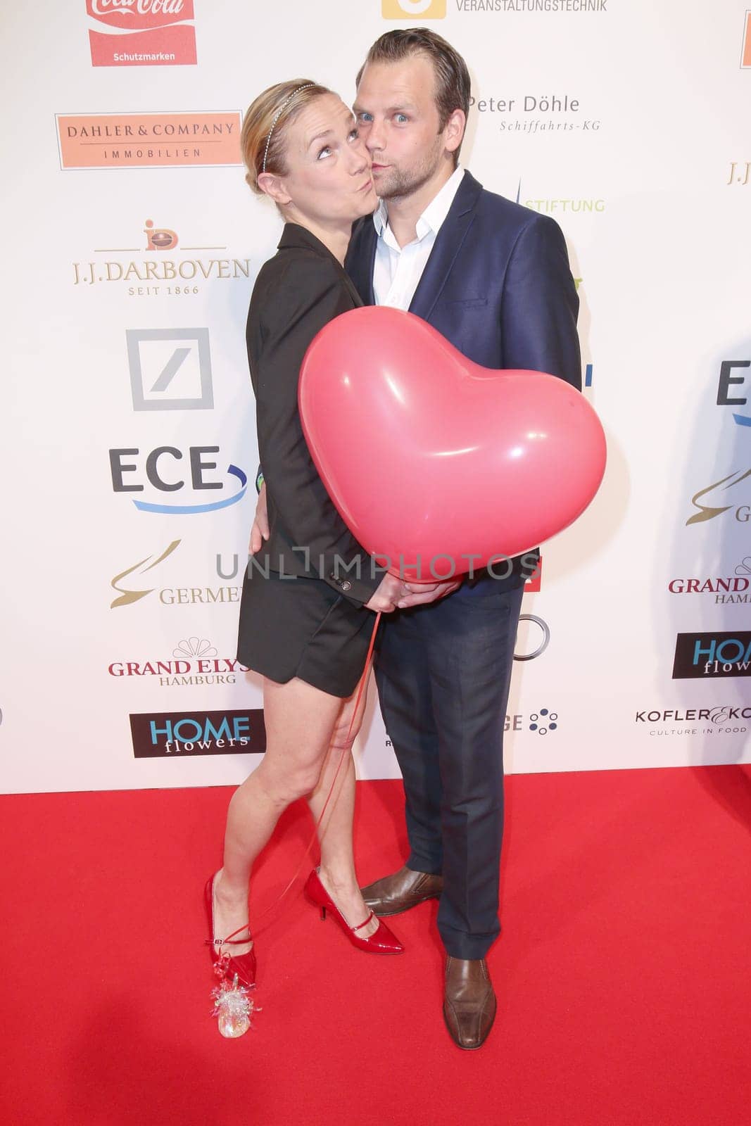 Rhea Harder me husband Joern,charity event "The little heart in the center"" at the Curio Haus,Hamburg,14.06.2015"