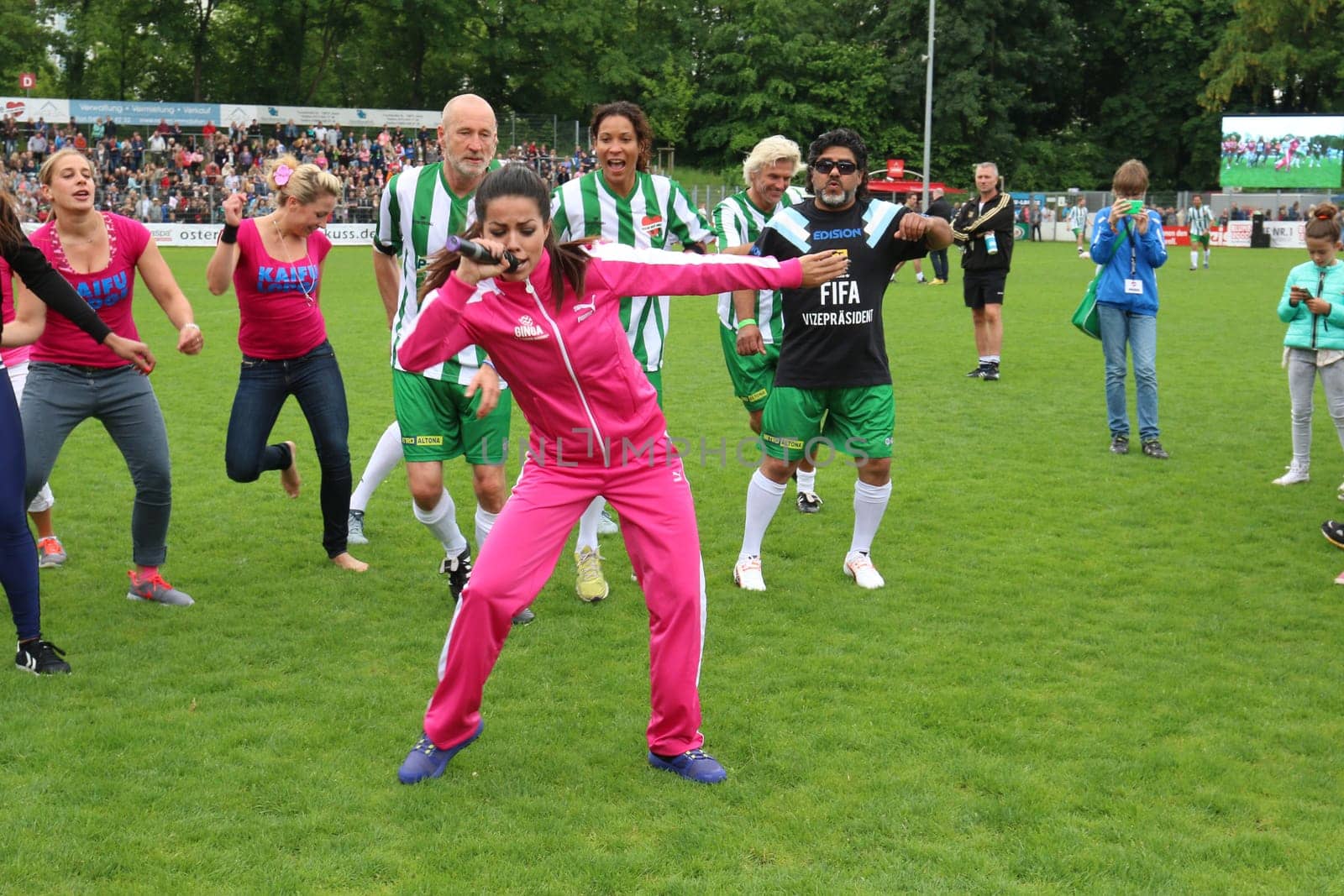 Fernanda Brandao waking up with Peter Lohmeyer,Annabelle Mandeng in the background,The charity football game Kicking with heart in the Stadion Hoheluft,Hamburg,14.06.2015