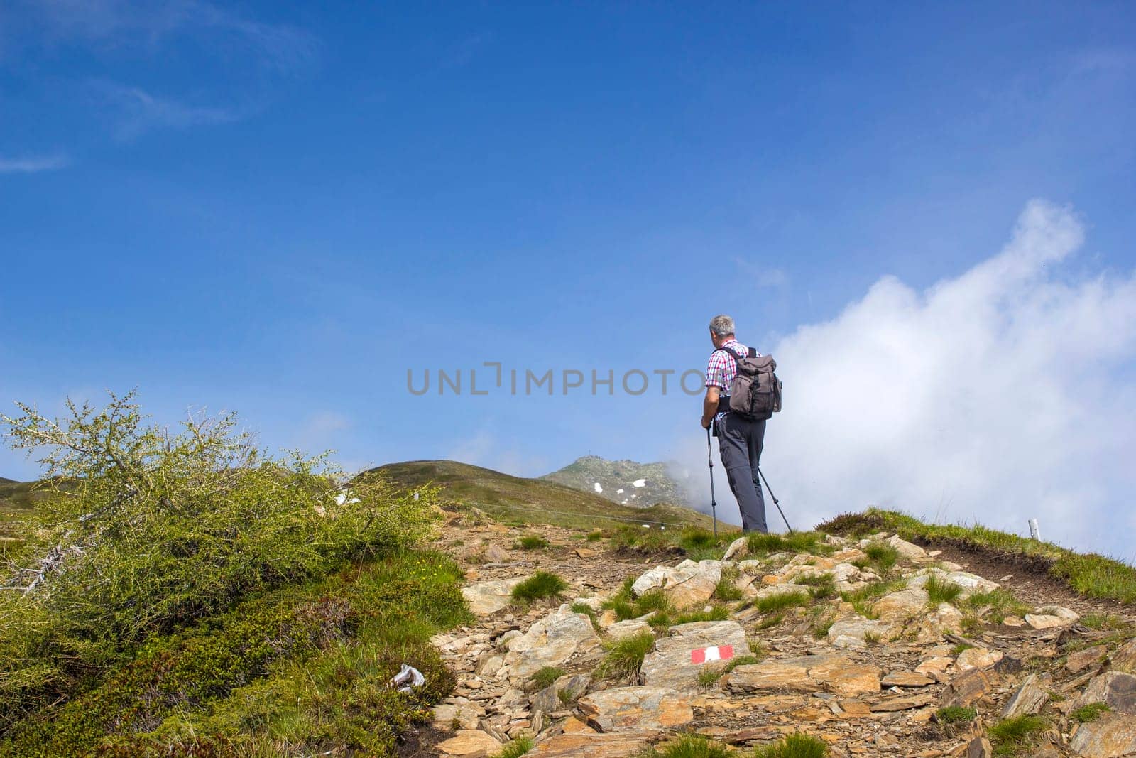 man trekking in the mountains, Alps in Austria, Lienzer Dolomiten, East Tyrol