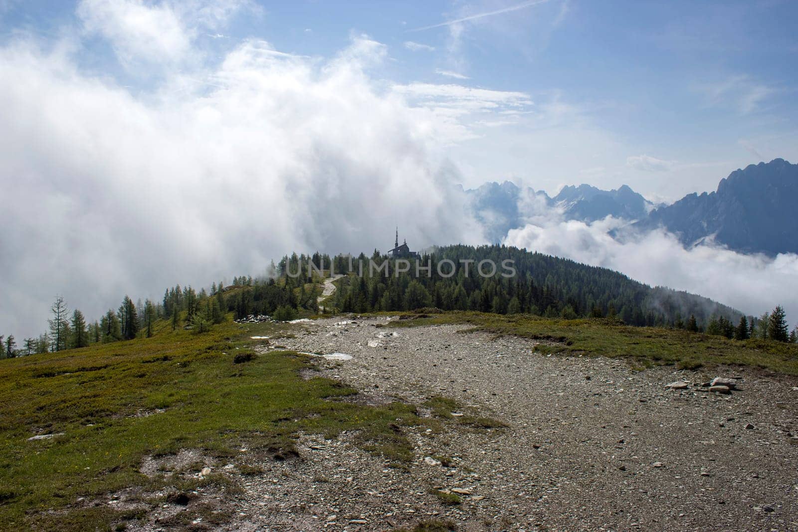 Landscape of Lienz Dolomites in Austria. Road and panorama of massive Alpine mountains