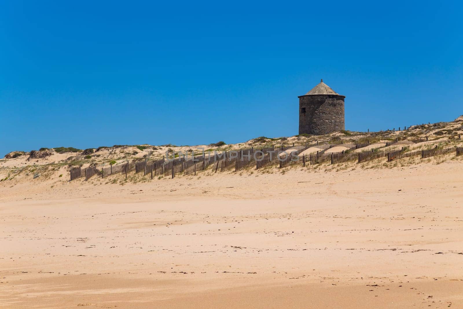 Ancient windmill at Apulia beach, north coast, Esposende, Portugal