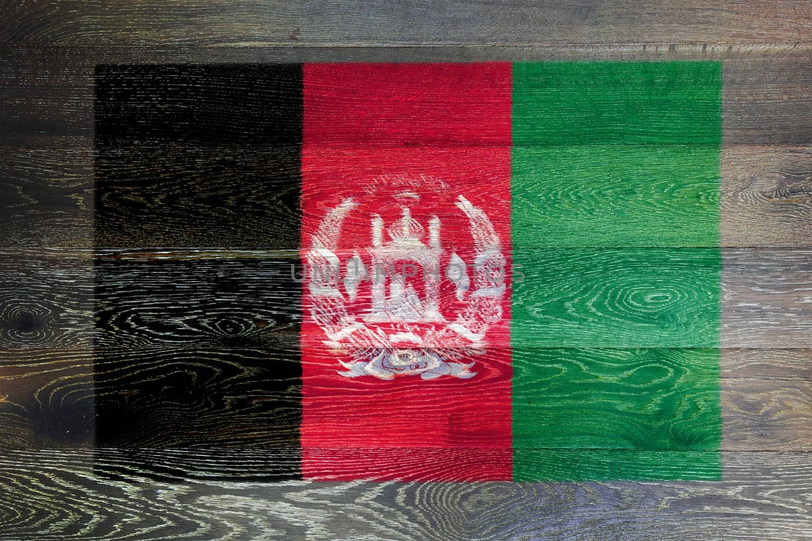 An Afghanistan flag on rustic old wood surface background