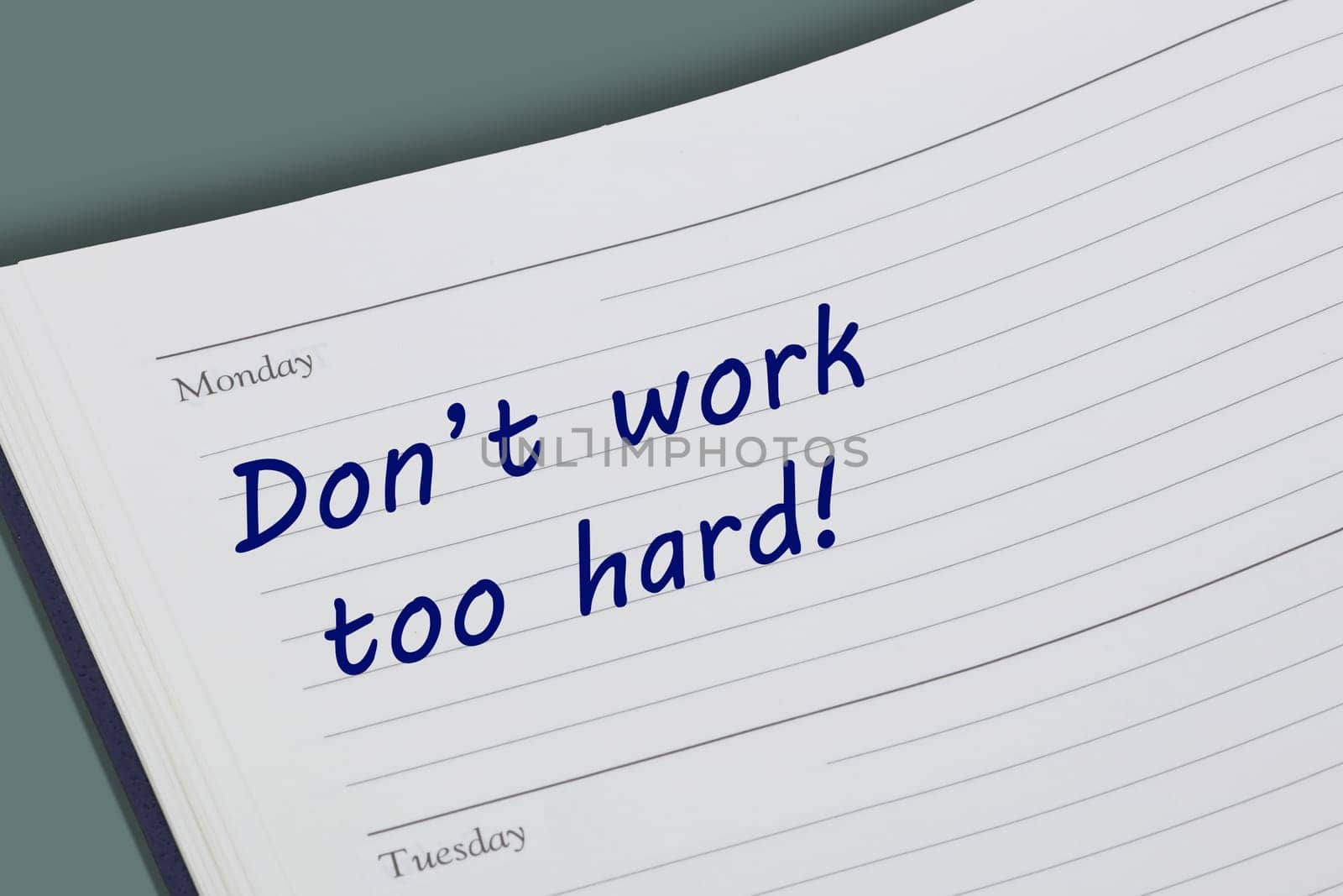 A Dont work too hard advice note in a diary page