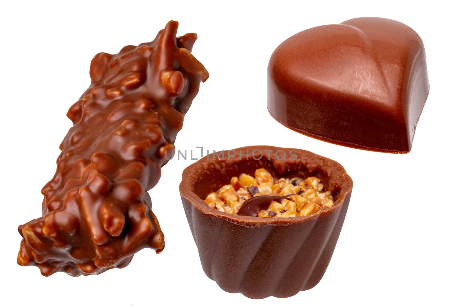 Chocolate candies collection. Set of a beautifully assortment of various chocolate candies sweets isolated on a white background. Macro. Christmas or other holidays.