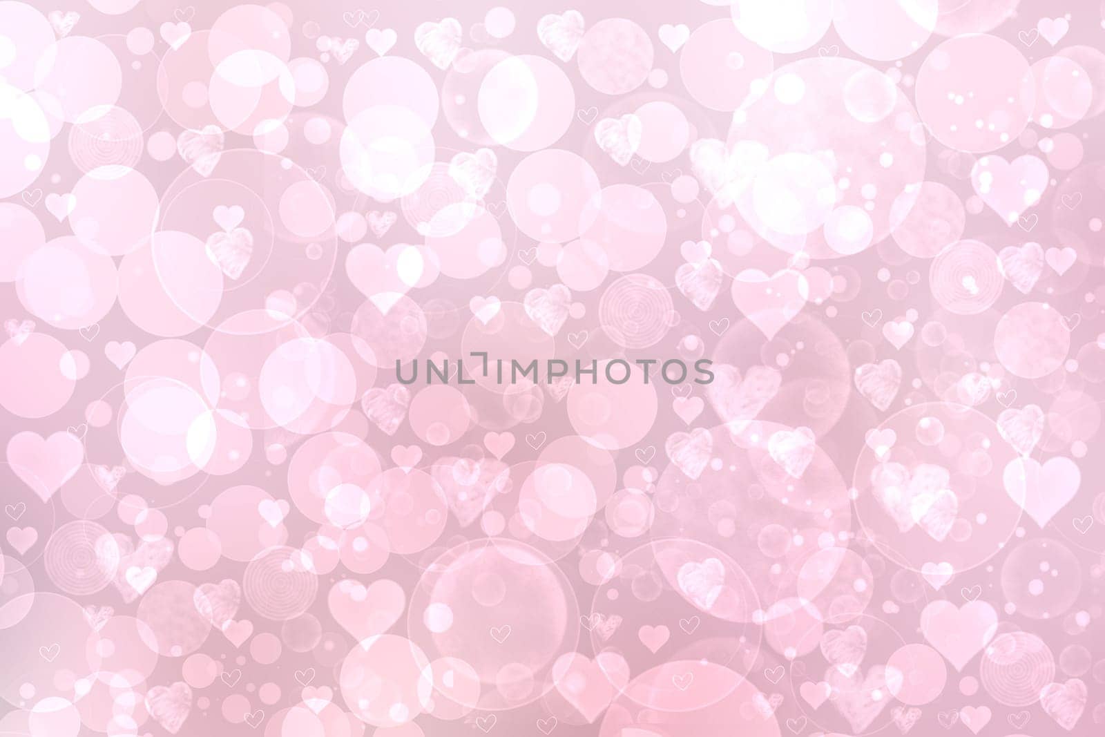 Abstract festive blur light pink pastel background with white pink hearts inside love bokeh for wedding card or Valentine day.  Romantic textured backdrop with space for your design. Card concept.