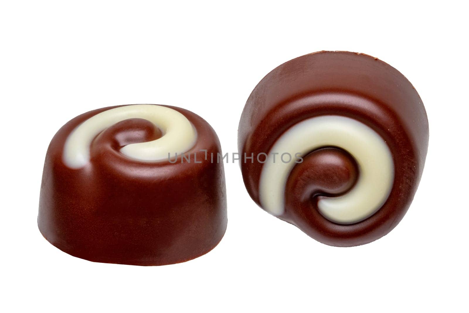 Chocolate candy or delicious truffle balls isolated on a white background. Macro. Christmas or other holidays. Gourmet chocolate bonbons.