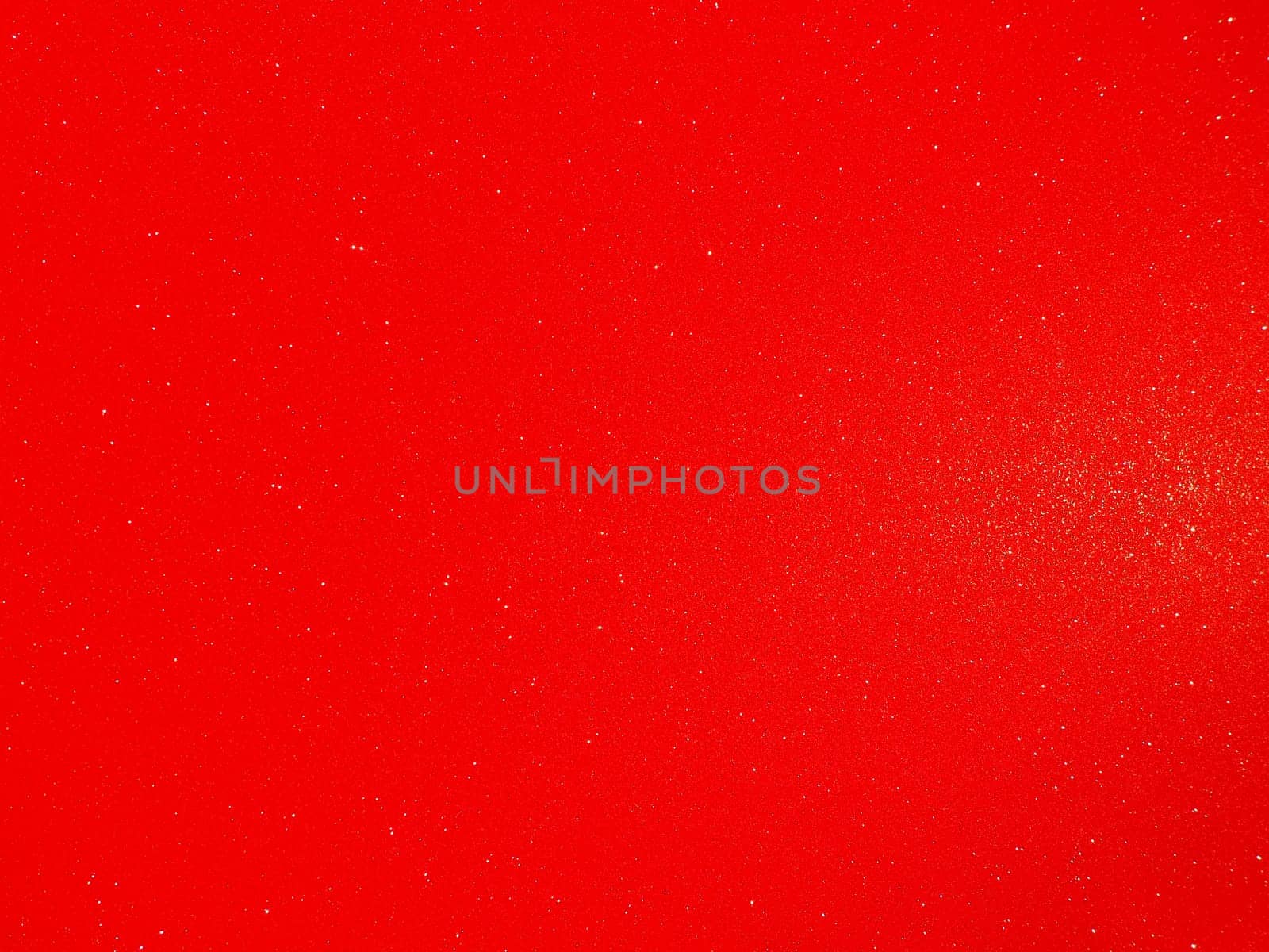 Red background, arched scarlet. Nice holiday color. Background with shimmer, gradient, white dots. Photograph of sparkling colored paper