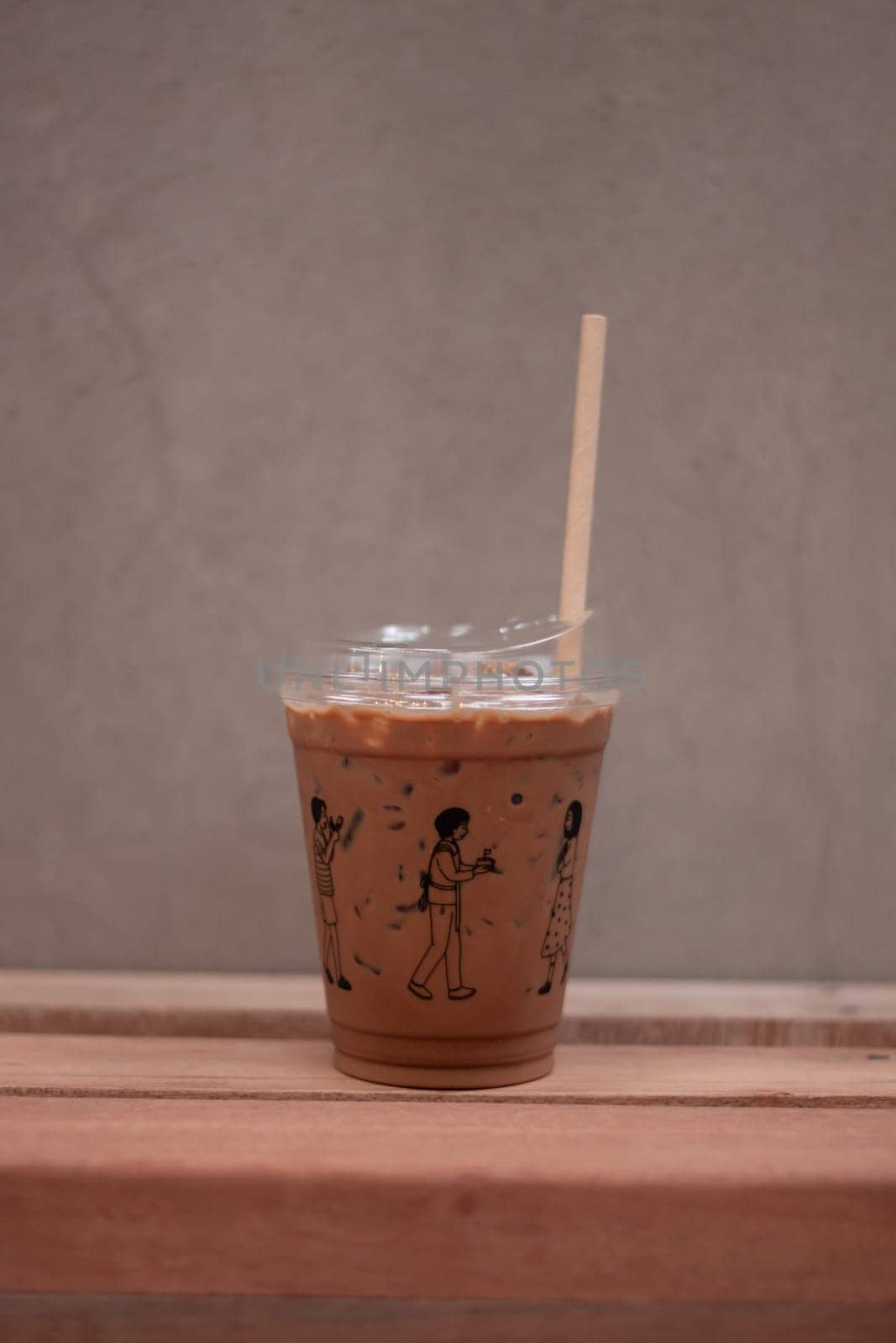 Iced mocha on wooden table, stock photo