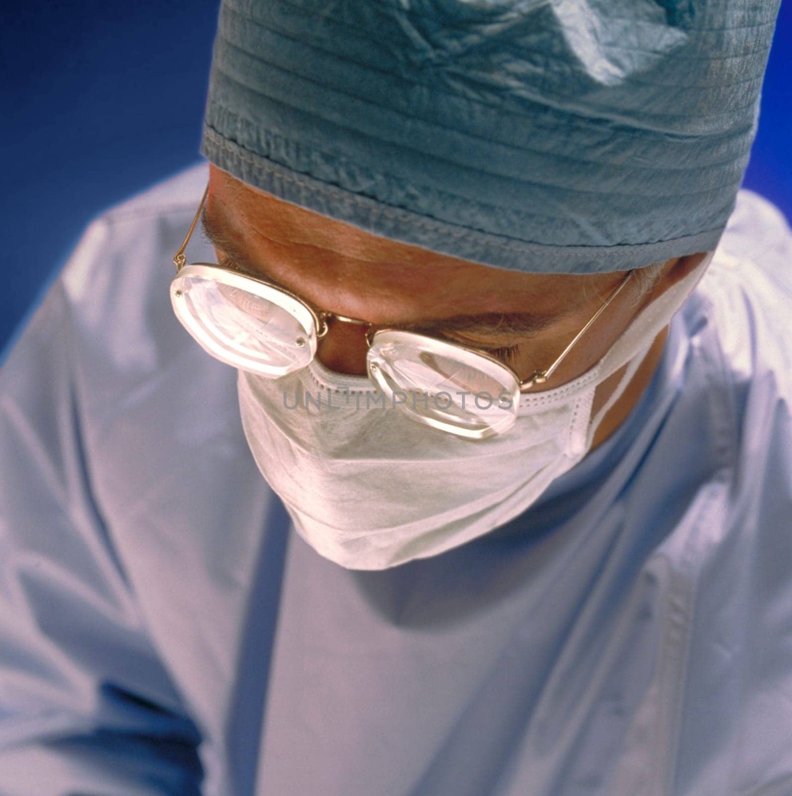 A surgeon in a operation room in a hospital.