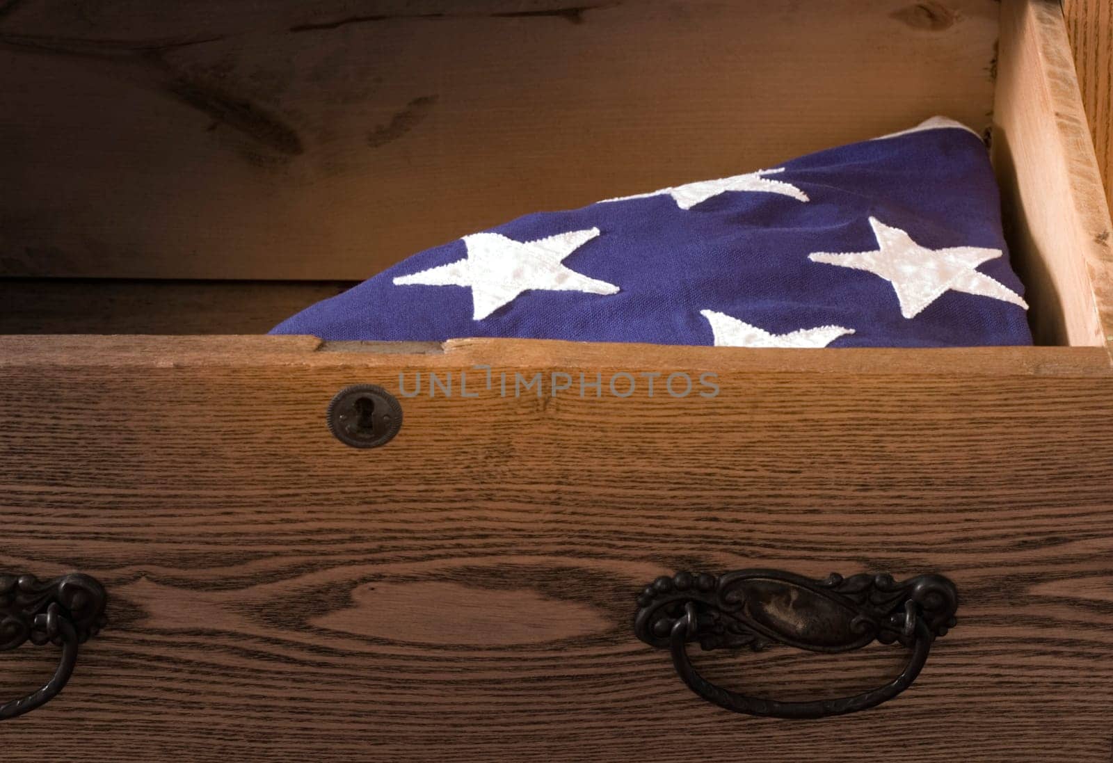 An American Flag of a deceaced veteran lays in a dresser drawer.