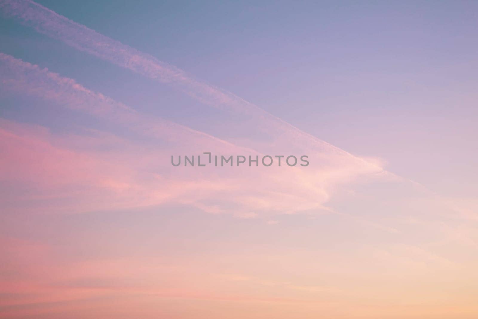 Pink and violet sunset clouds sky. Dream magic evening sky background