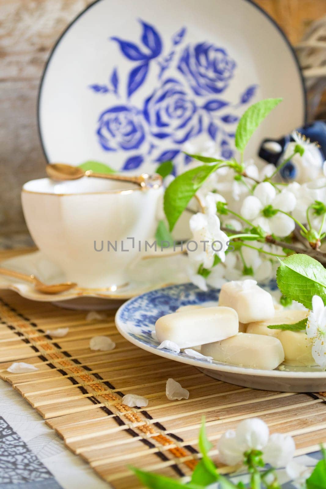 Breakfast in romantic style - mother's day tray with food and flowers. Vertical image
