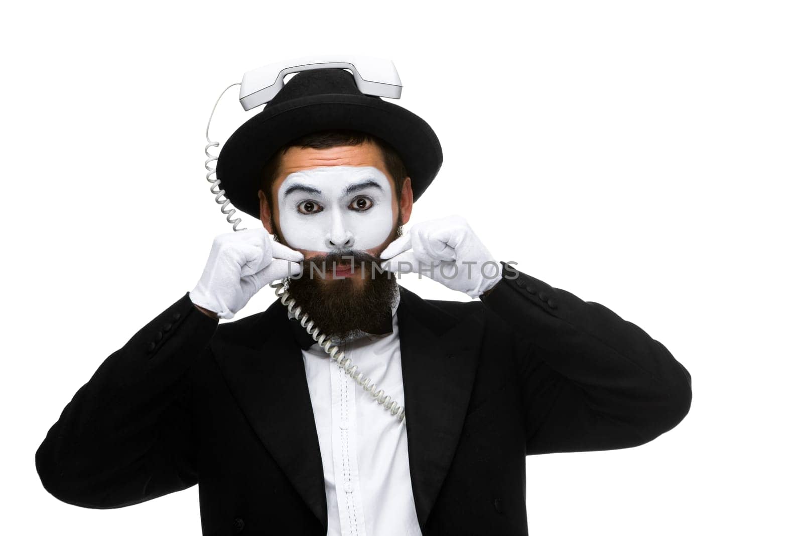 man in the image mime holding a handset isolated on white background. The concept -  I'm always in touch