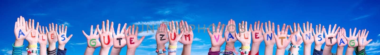 Children Hands Building Colorful German Word Alles Gute Zum Valentinstag Means Happy Valentines Day. Blue Sky As Background