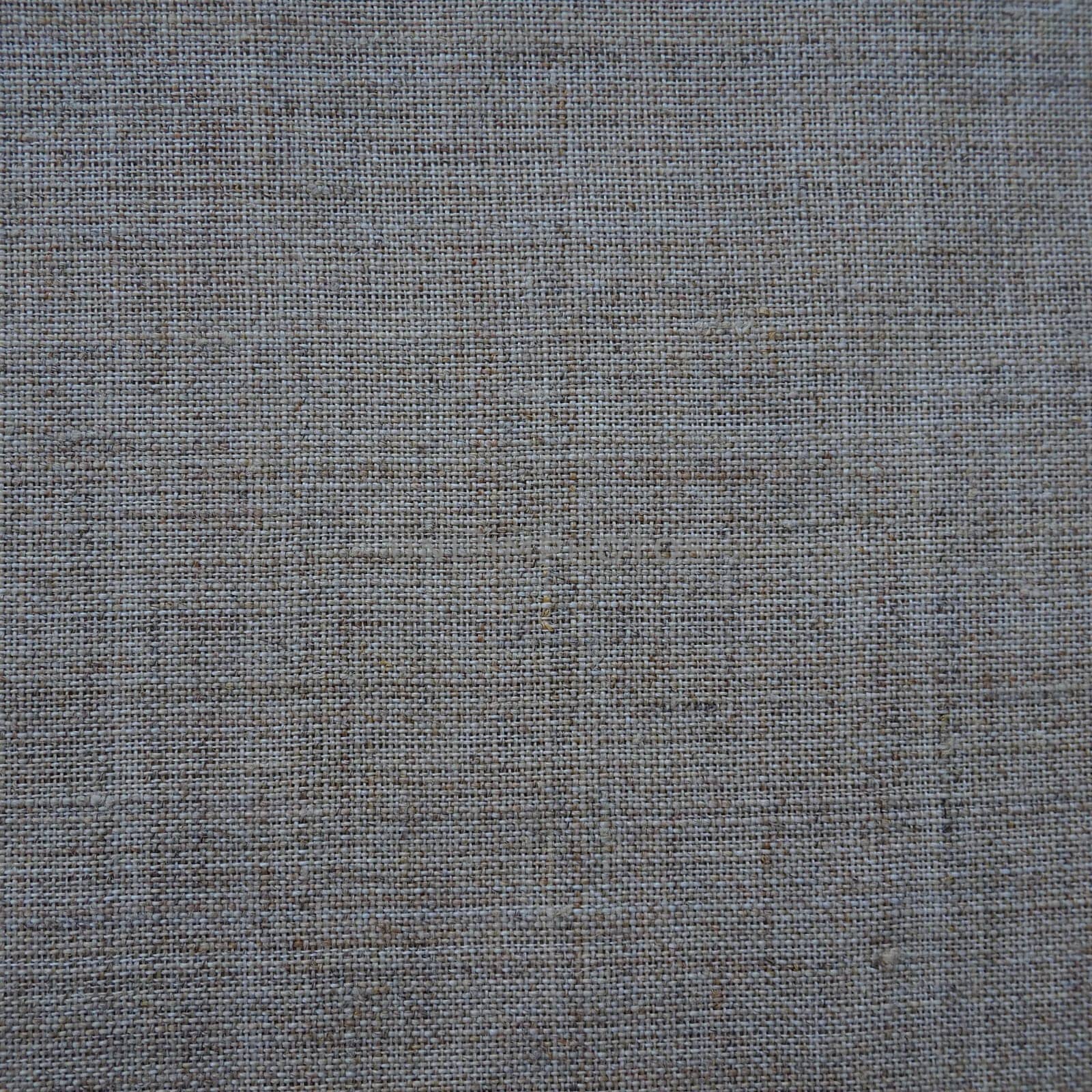 Fabric texture background. Gray fabric with weave. Natural slightly wrinkled look of the material. Uniform copy space background. Cotton, canvas or woolen thin fabric laid evenly on the surface