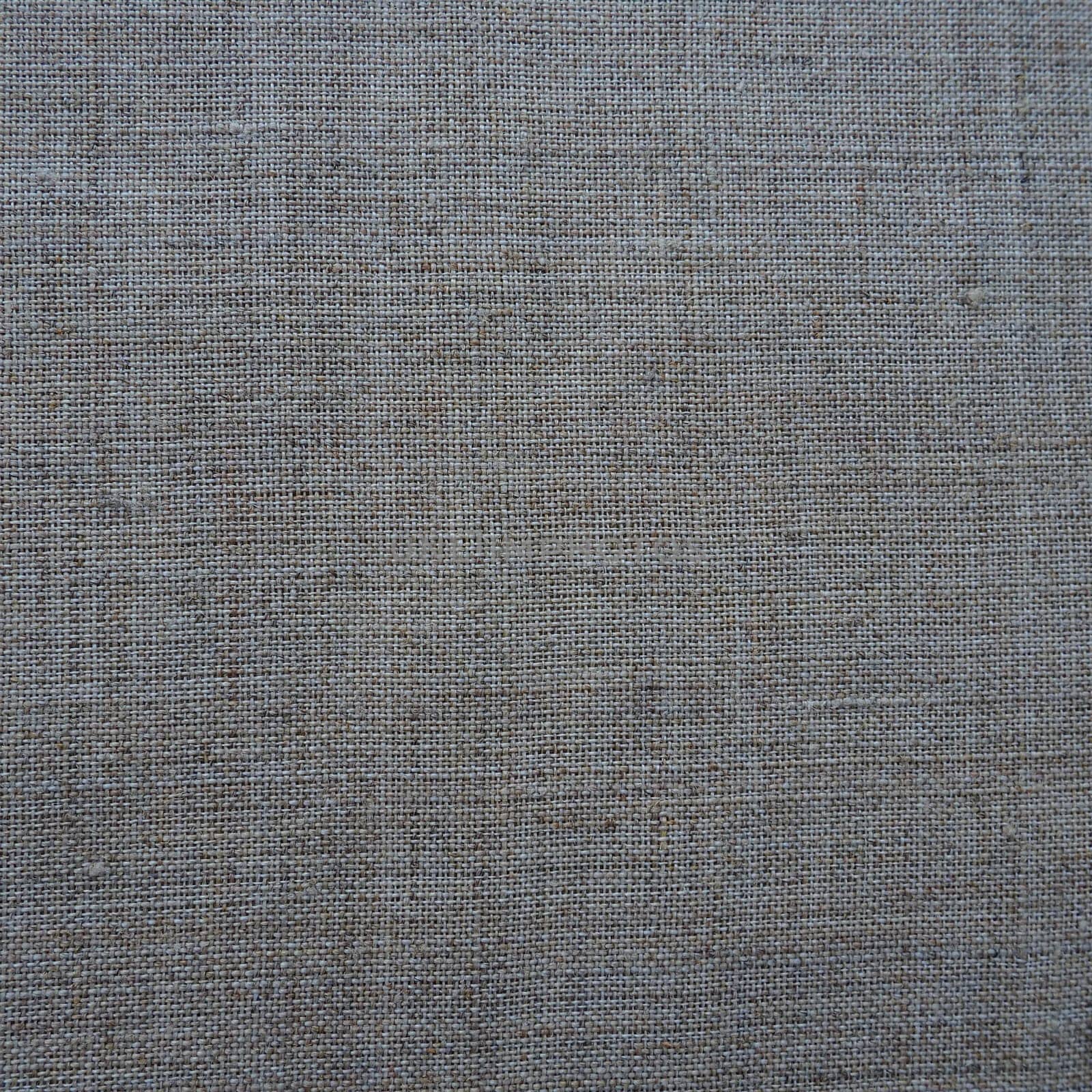 Fabric texture background. Gray fabric with weave. Natural slightly wrinkled look of the material. Uniform copy space background. Cotton, canvas or woolen thin fabric laid evenly on the surface
