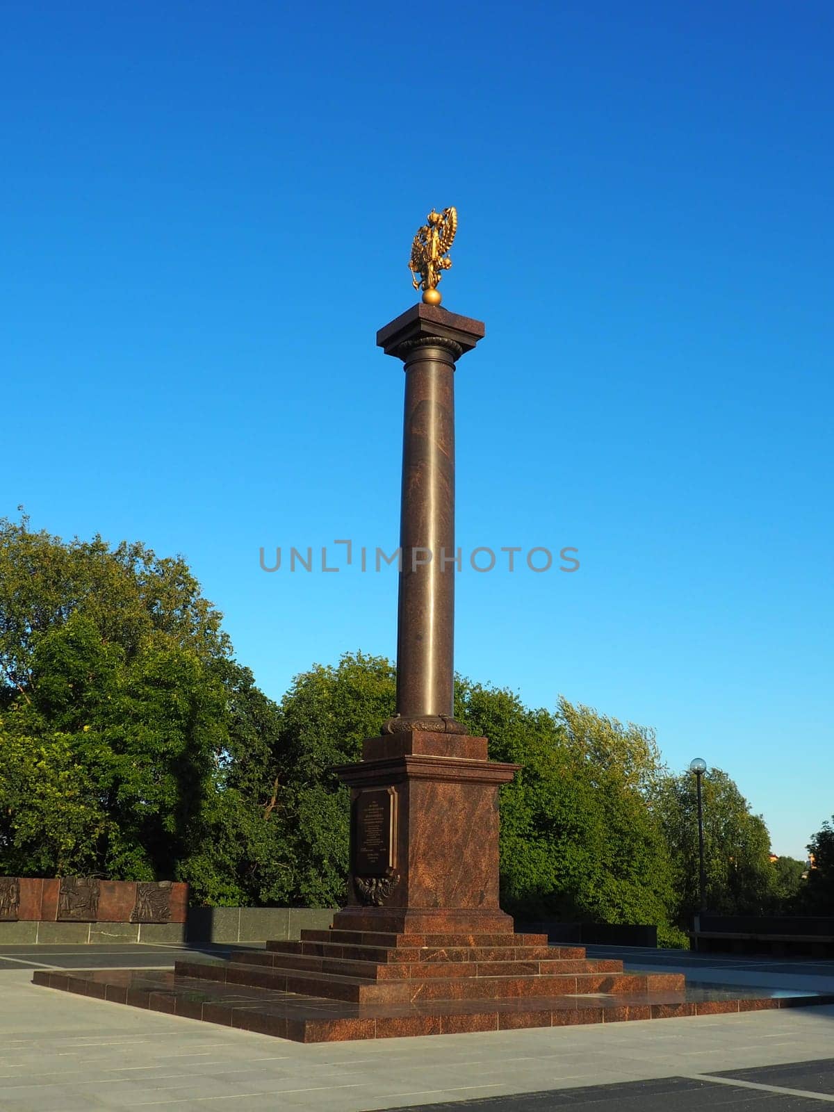 Petrozavodsk, Karelia, August 3, 2022 Monument-stele City of military glory, honorary title. Granite column with a bronze double-headed eagle. Pedestal on the alley of sister cities, Kirov Square.