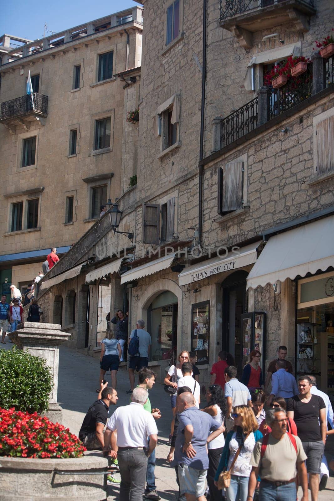 Tourists gather at the water fountain of San Marino. San Marino is the 5th smallest country in the world.