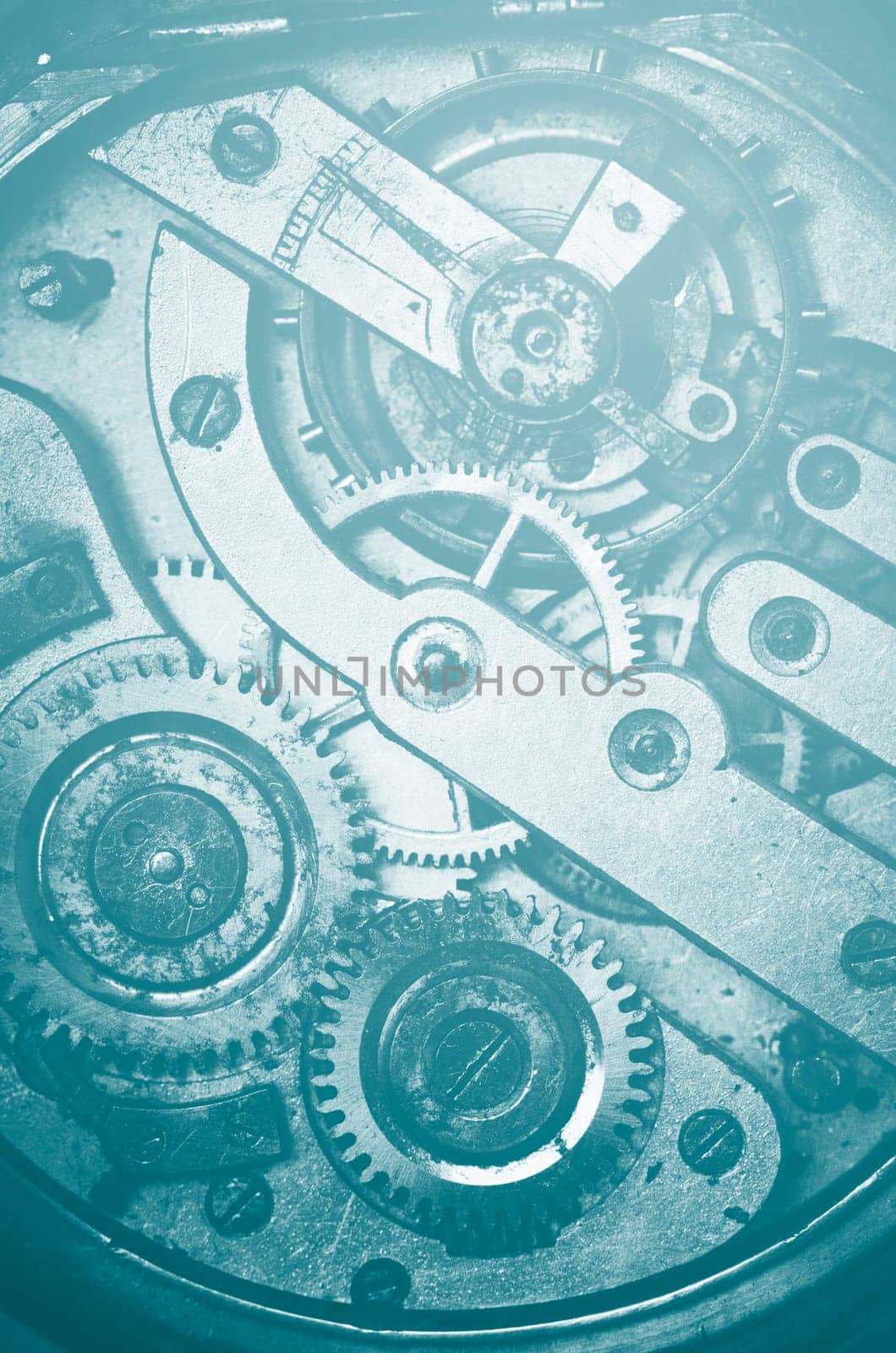 Vintage gear and cogs in pocket watch mechanism. Inside old clock cogwheel. Time concept.