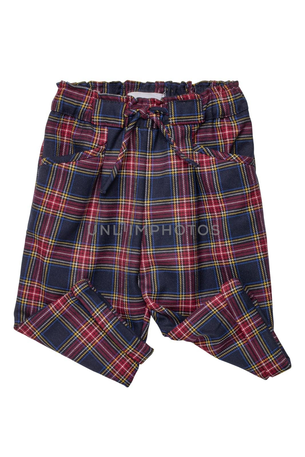 Summer shorts isolated. Close-up of a stylish fashionable plaid short pants with elastic and bow. Clipping path.Tartan checkered fabric texture background.