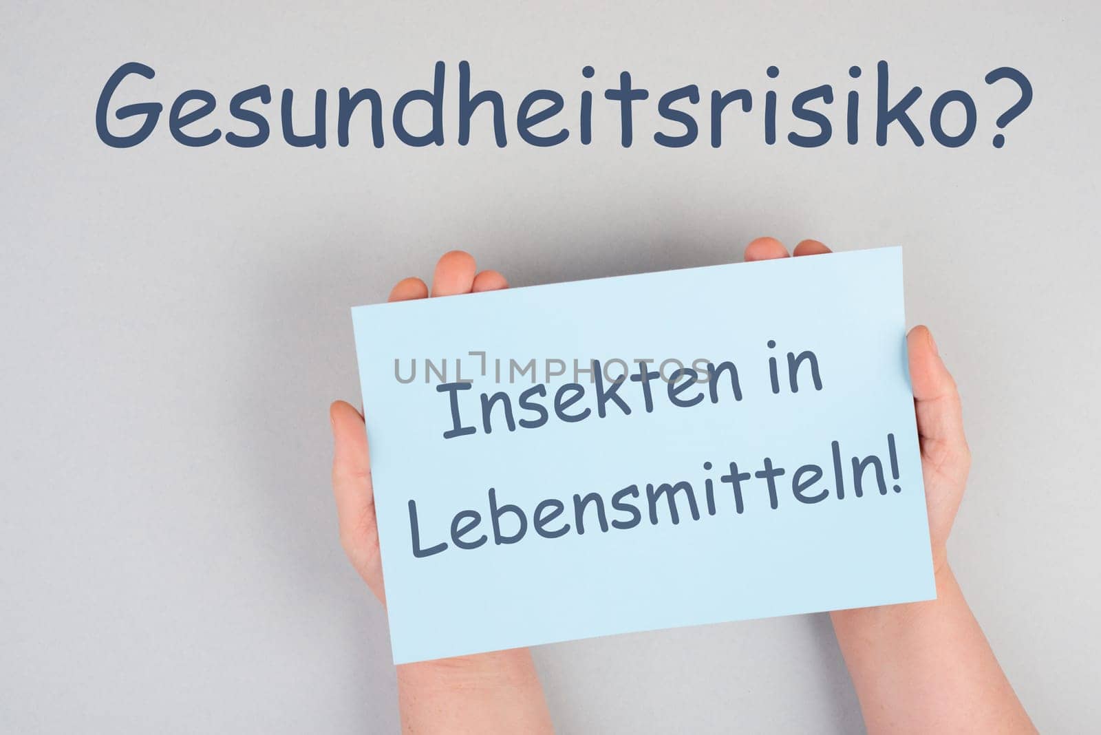 Insects in food, health risk is standing in german language on the paper, new EU regualtion for ingredients in bread, pasta, chocolate, powder of cricket and beetle allowed
