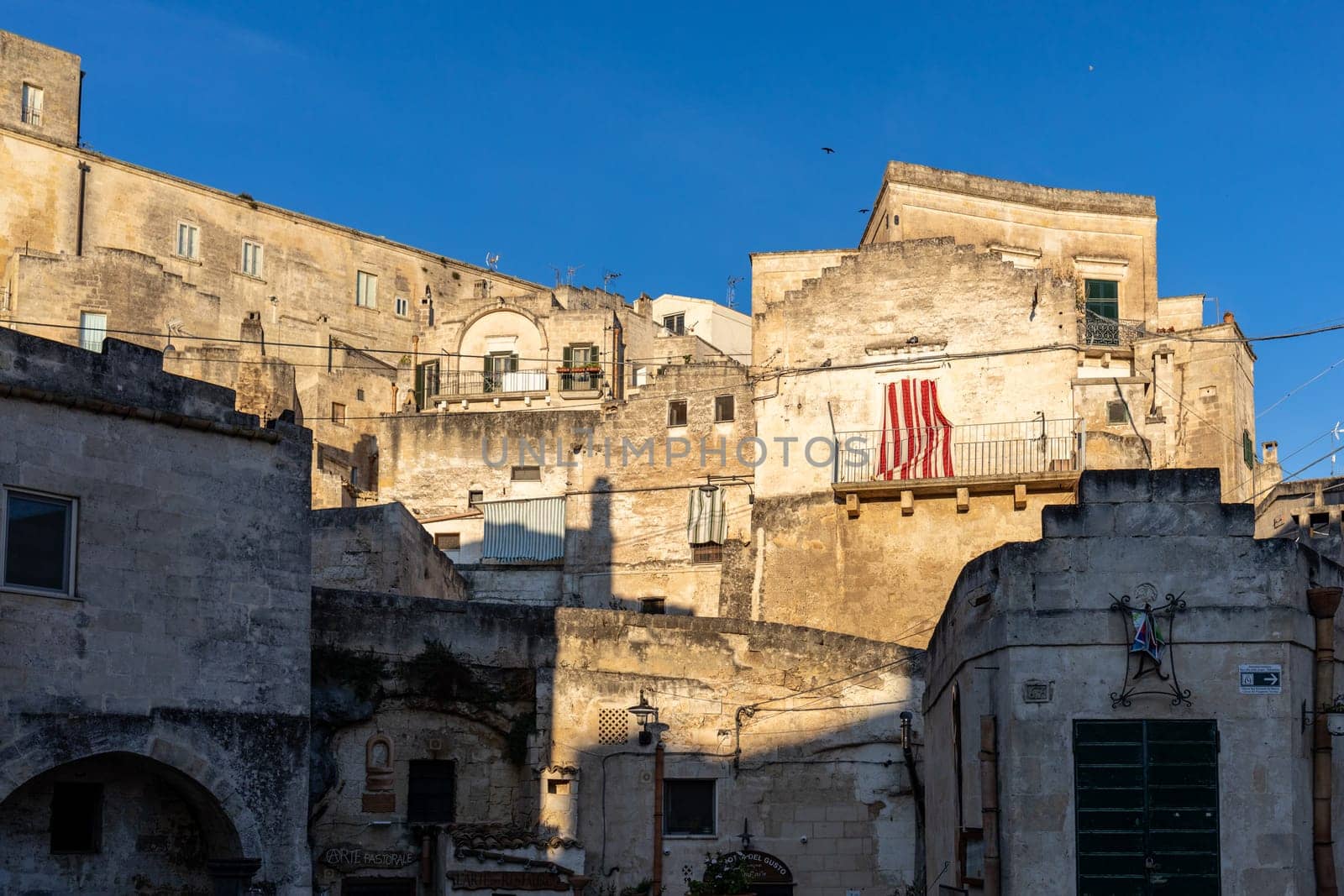 Matera, Italy - September 15, 2019: View of the Sassi di Matera a historic district in the city of Matera, well-known for their ancient cave dwellings. Basilicata. Italy
