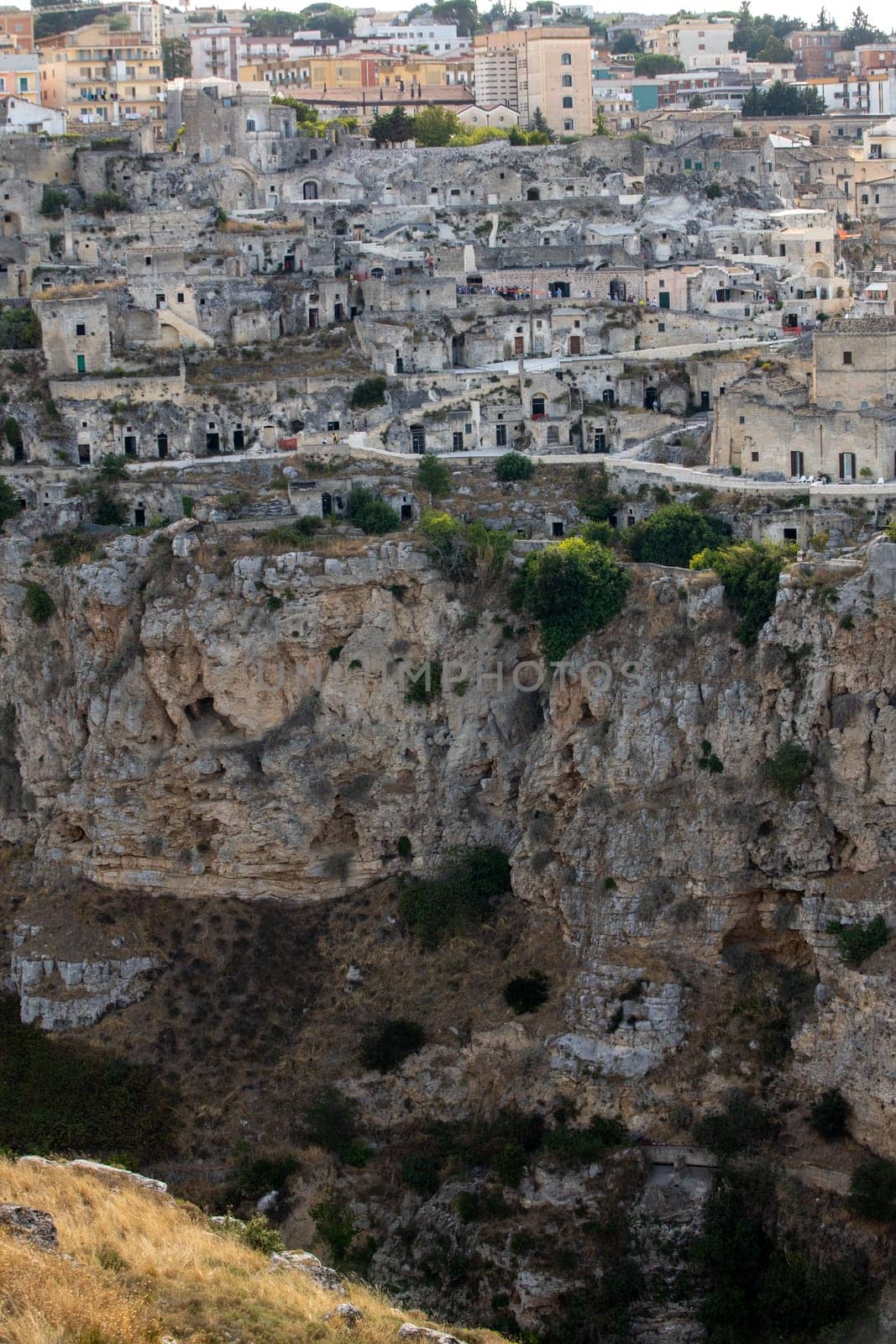 Panoramic view of Sassi di Matera a historic district in the city of Matera, well-known for their ancient cave dwellings from the Belvedere di Murgia Timone,  Basilicata, Italy