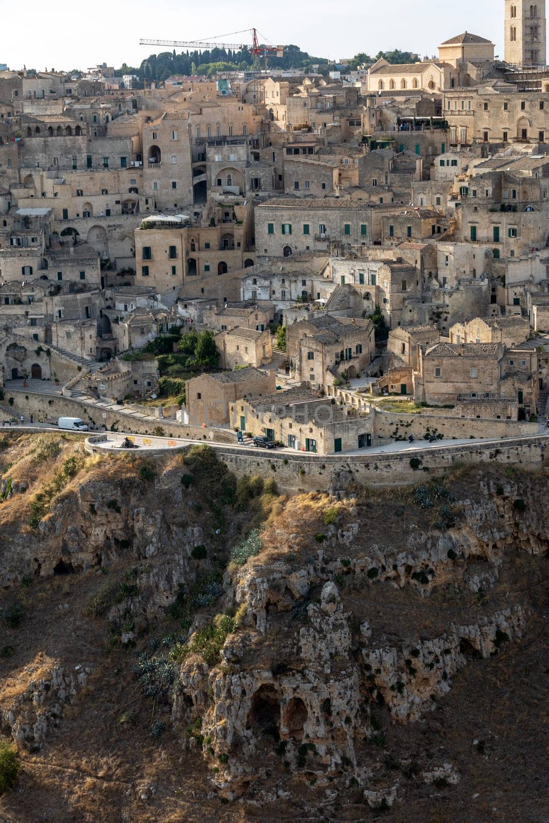 Panoramic view of Sassi di Matera a historic district in the city of Matera, well-known for their ancient cave dwellings from the Belvedere di Murgia Timone,  Basilicata, Italy