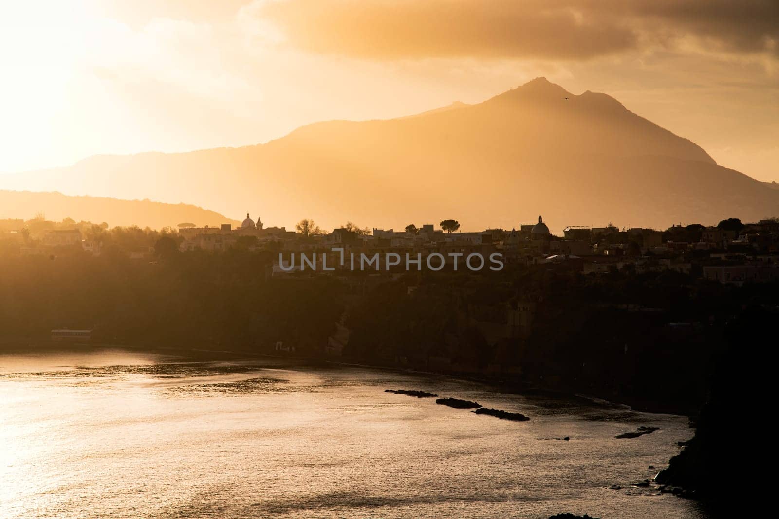Magic sunset over Procida Island with Ischia island in the background.