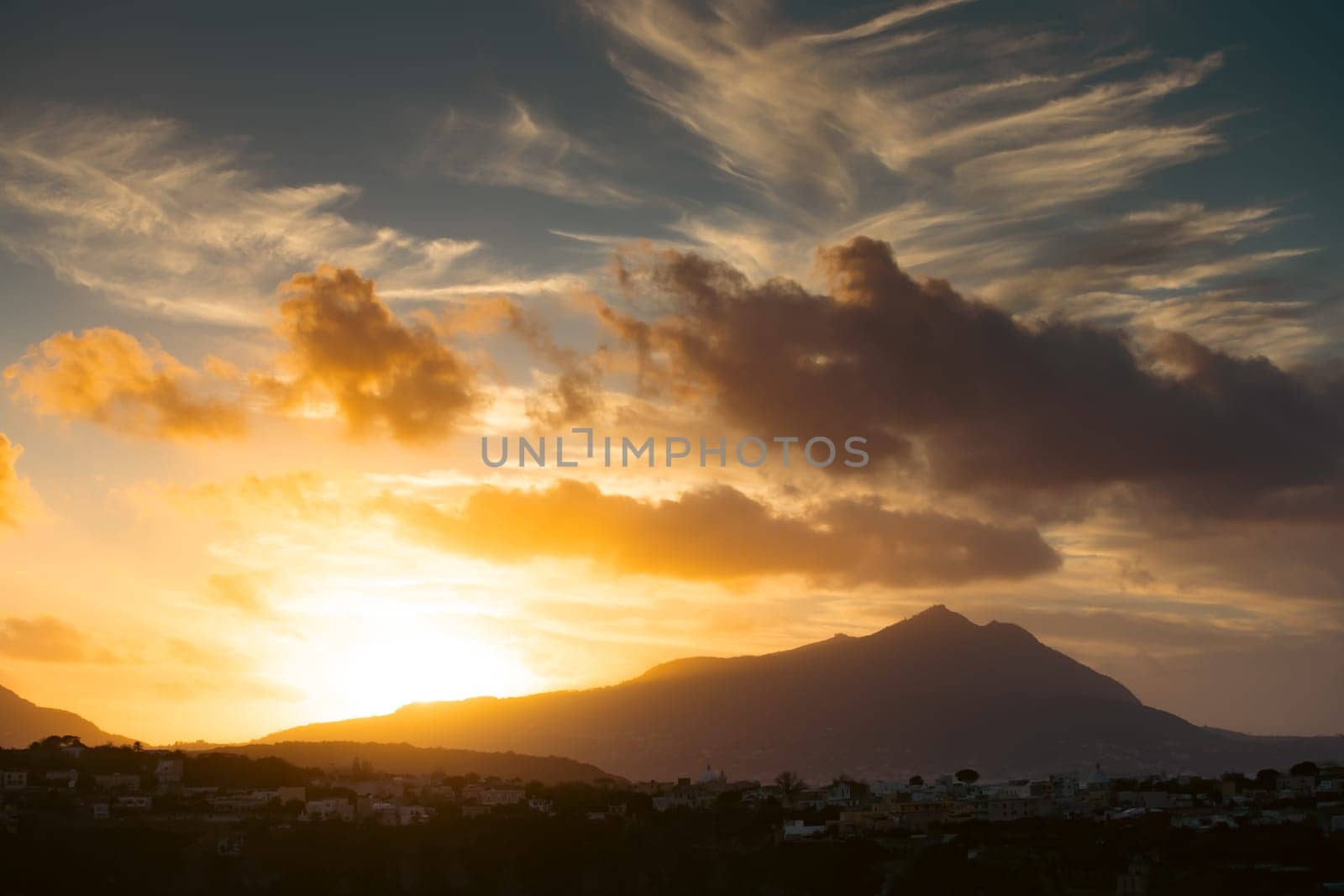 Magic sunset over Procida Island with Ischia island in the background.