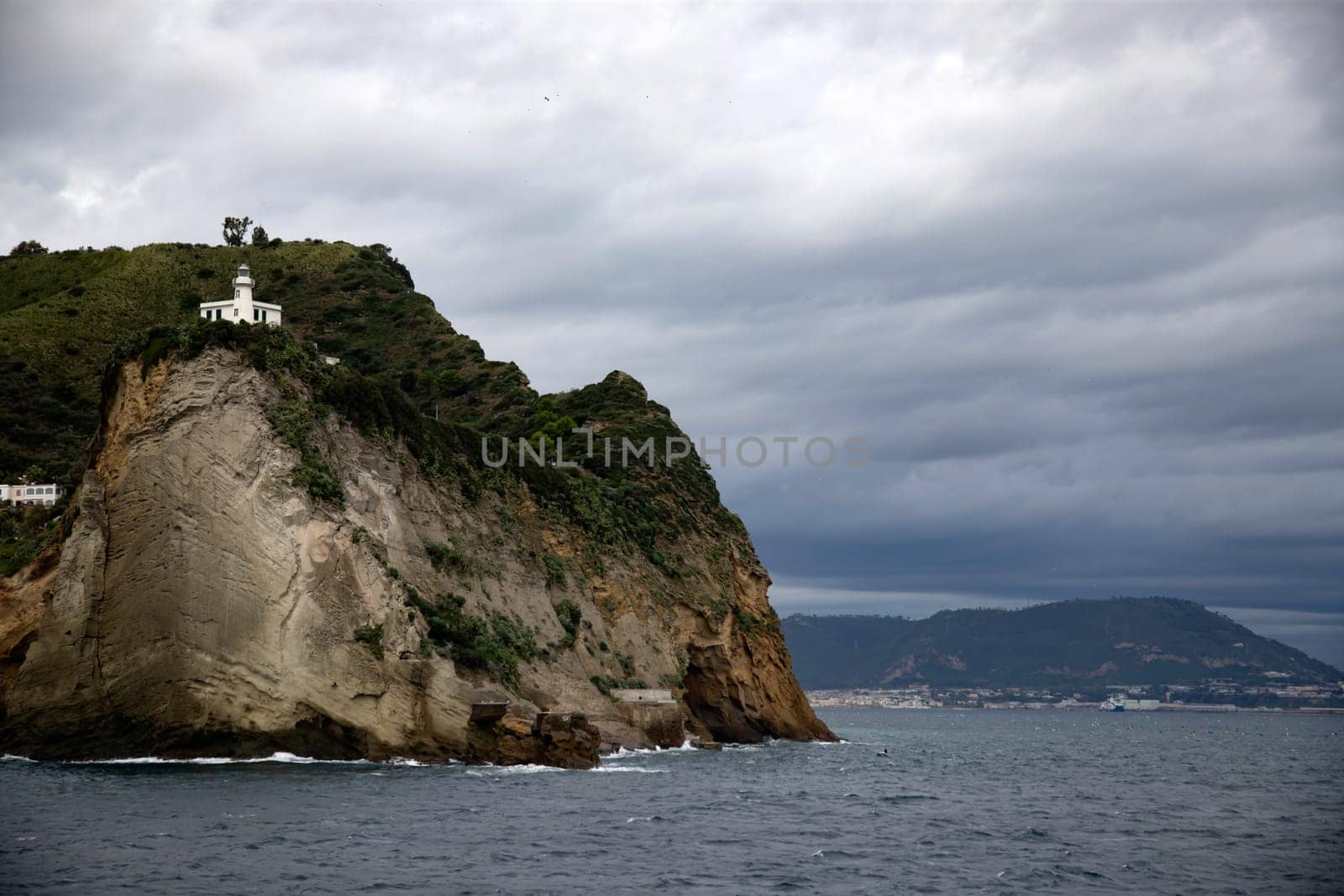Capo Miseno and its lighthouse that marks the northwestern limit of the Gulf of Naples, Italy