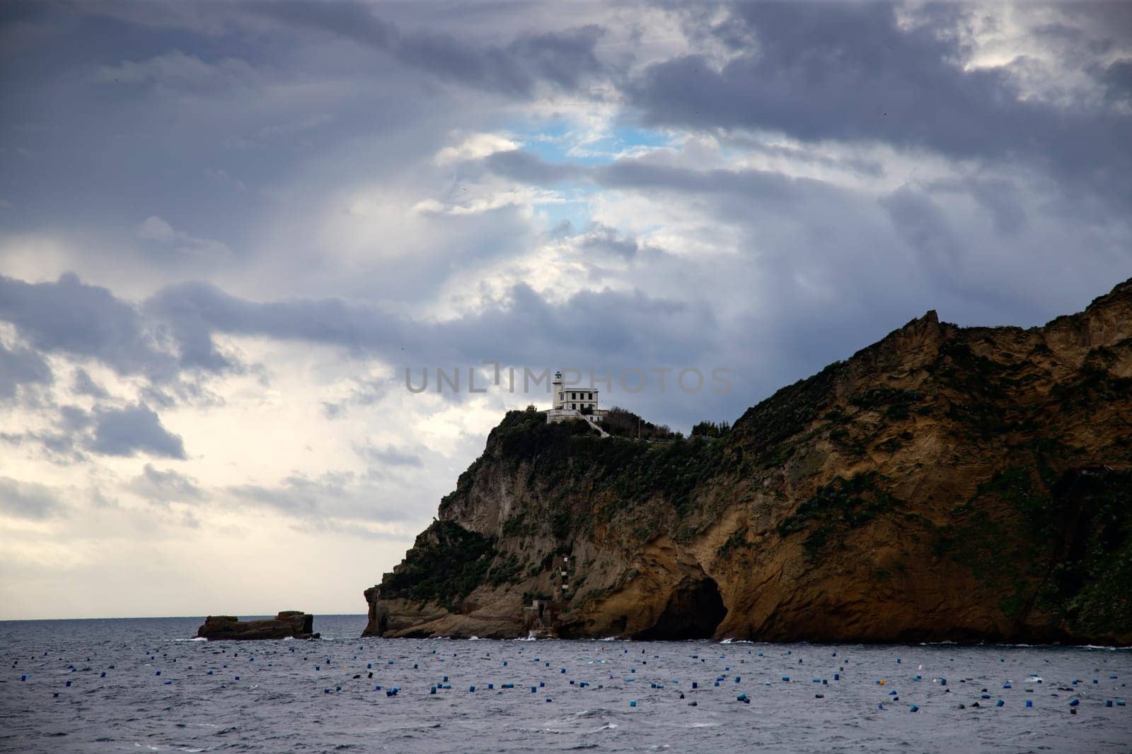 Capo Miseno and its lighthouse that marks the northwestern limit of the Gulf of Naples, Italy
