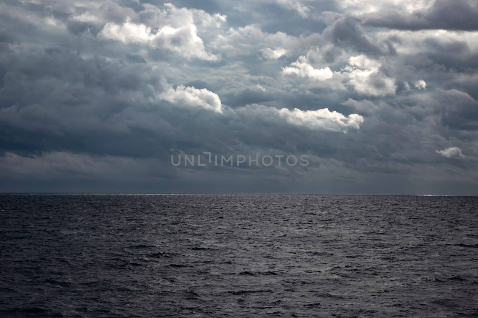 Beautiful colorful sky with approaching storm over the sea