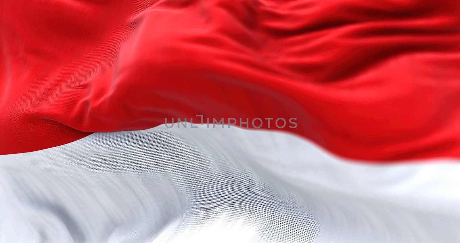 the Indonesia national flag waving in the wind. The Republic of Indonesia is a State of Southeast Asia. Rippled fabric. Textured background. Realistic 3d illustration. Close-up