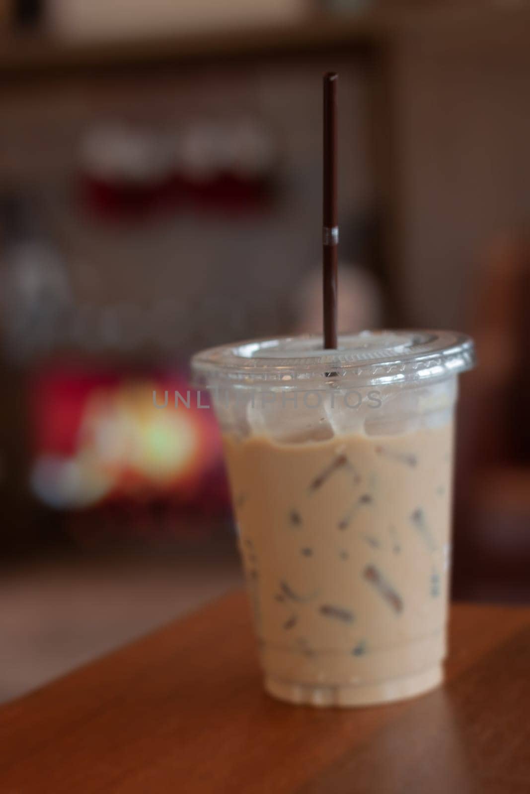 Iced coffee on wooden table, stock photo