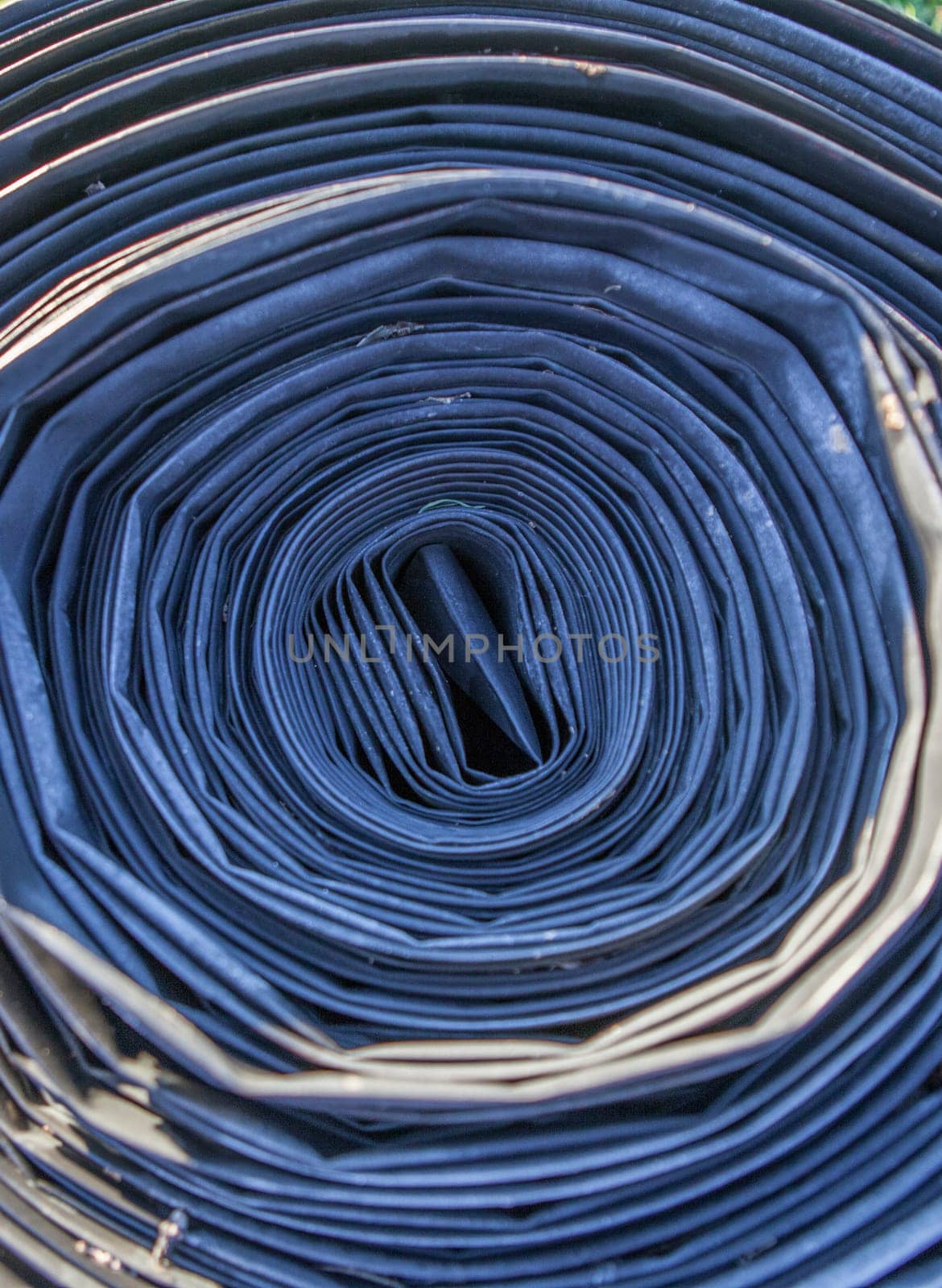 Rolled tape of flexible irrigation tubing system. Overhead view