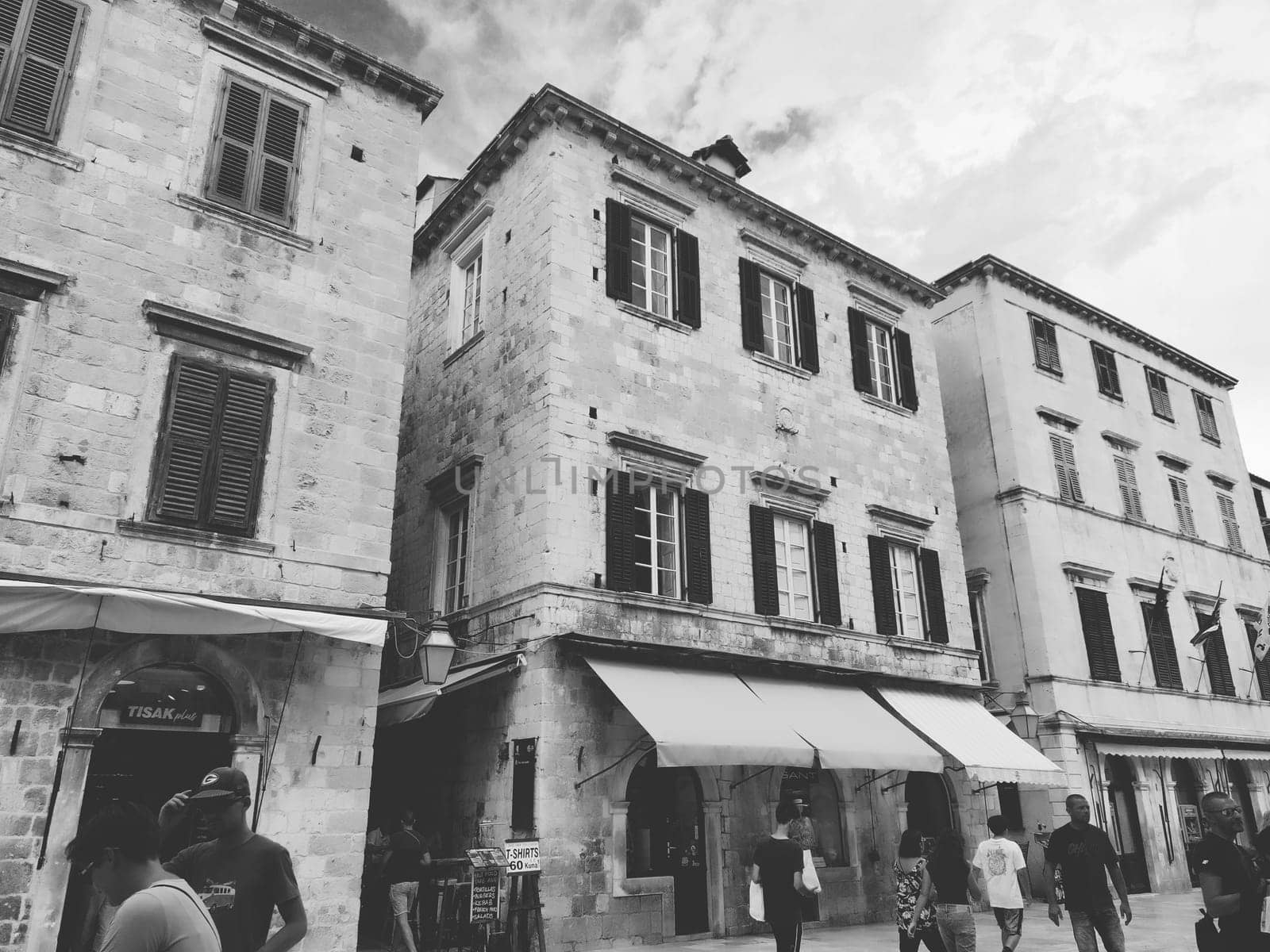 Stradun, Stradone is the main street of the historic city center of Dubrovnik in Croatia. architectural sights. A popular place for tourist walks. People are walking August 14, 2022 Black and white.