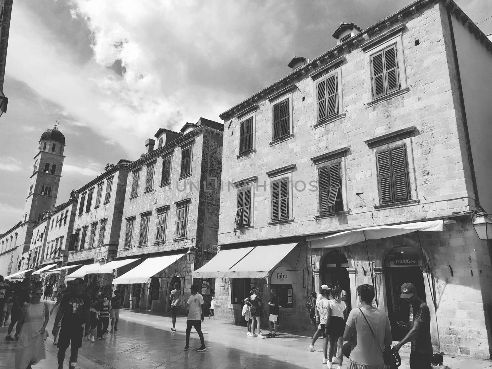 Stradun, Stradone is the main street of the historic city center of Dubrovnik in Croatia. architectural sights. A popular place for tourist walks. People are walking August 14, 2022 Black and white.