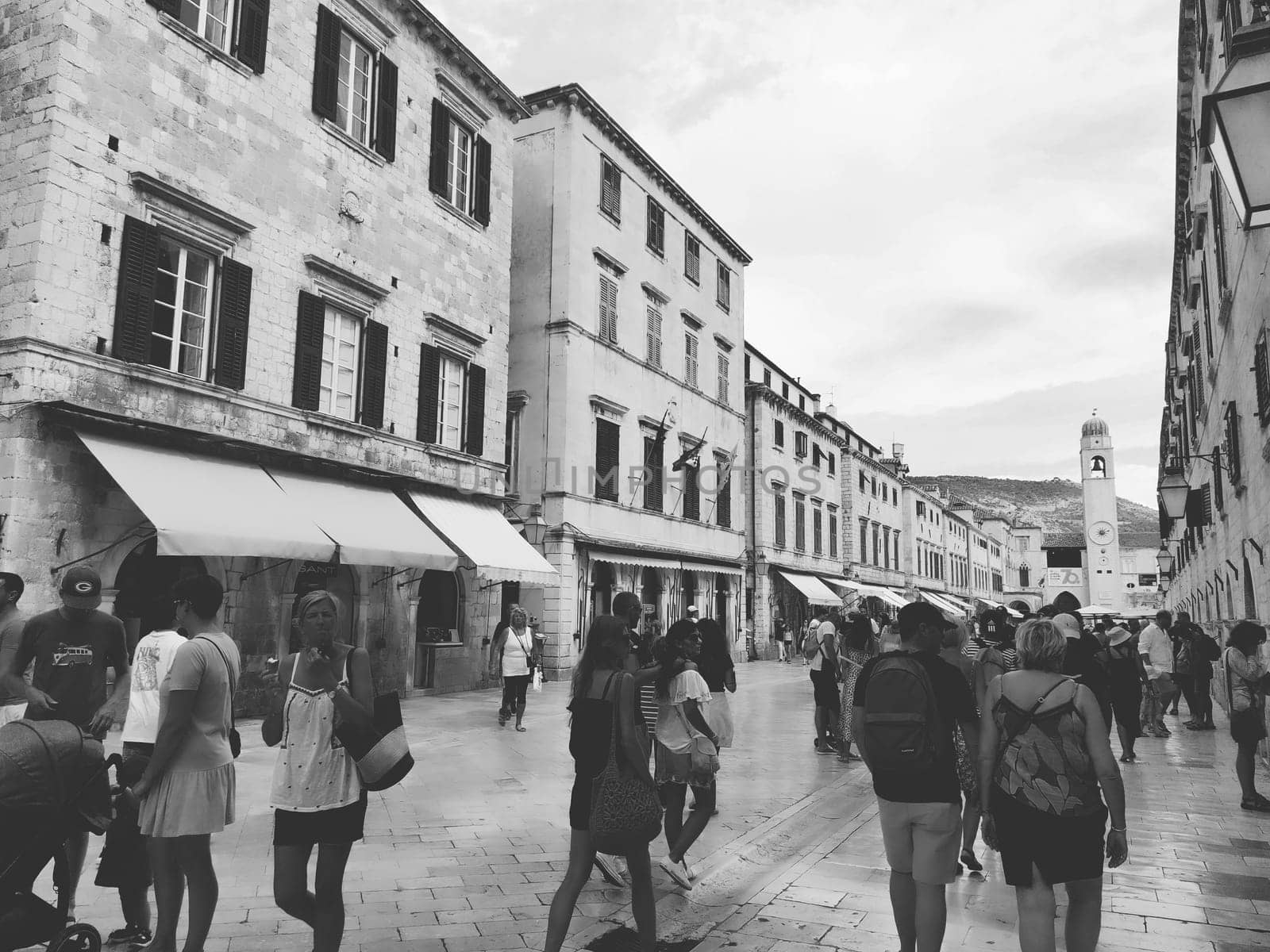 Stradun, Stradone is the main street of the historic city center of Dubrovnik in Croatia. architectural sights. A popular place for tourist walks. People are walking August 14, 2022 Black and white.