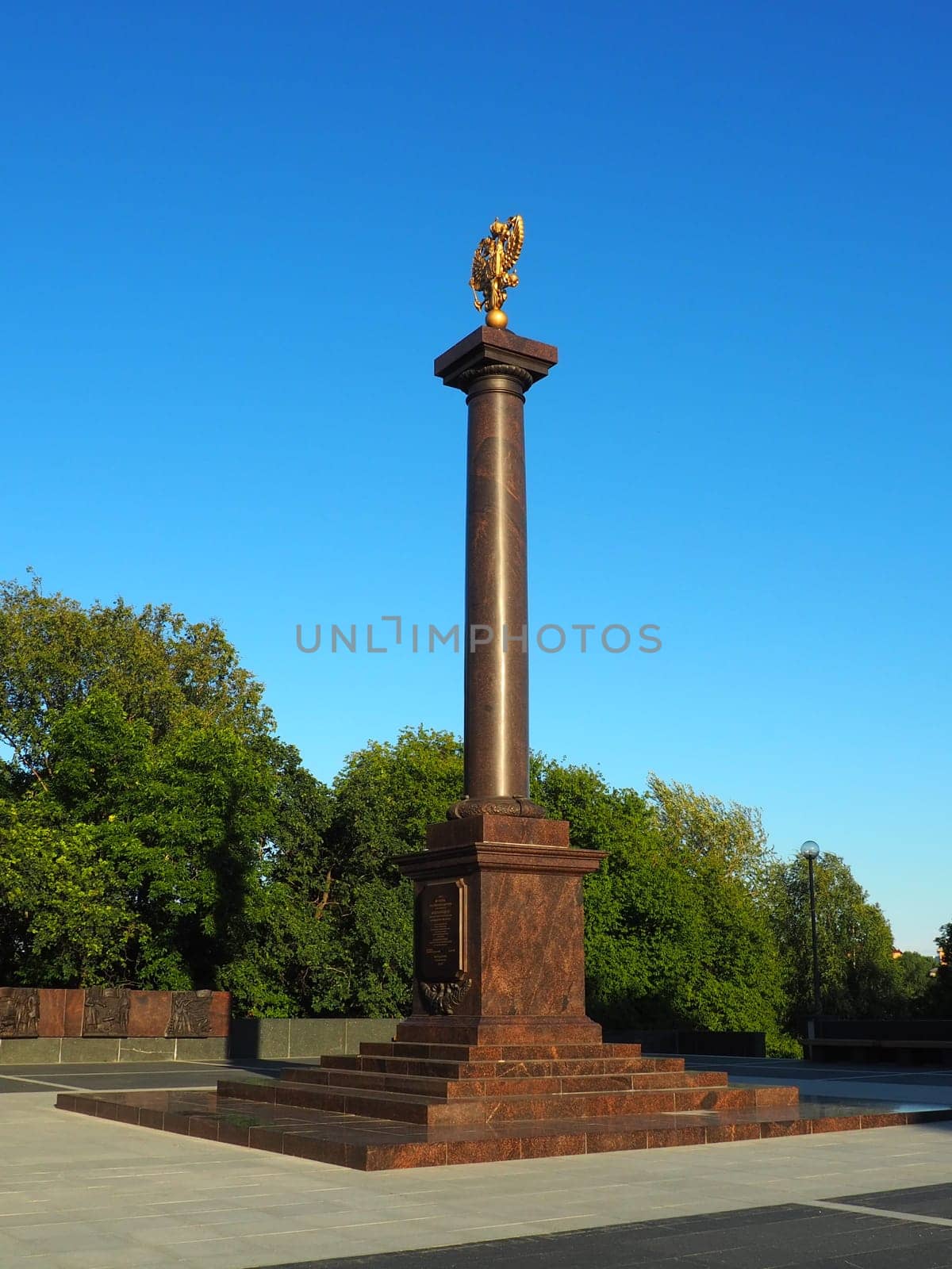 Petrozavodsk, Karelia, August 3, 2022 Monument-stele City of military glory, honorary title. Granite column with a bronze double-headed eagle. Pedestal on the alley of sister cities, Kirov Square.