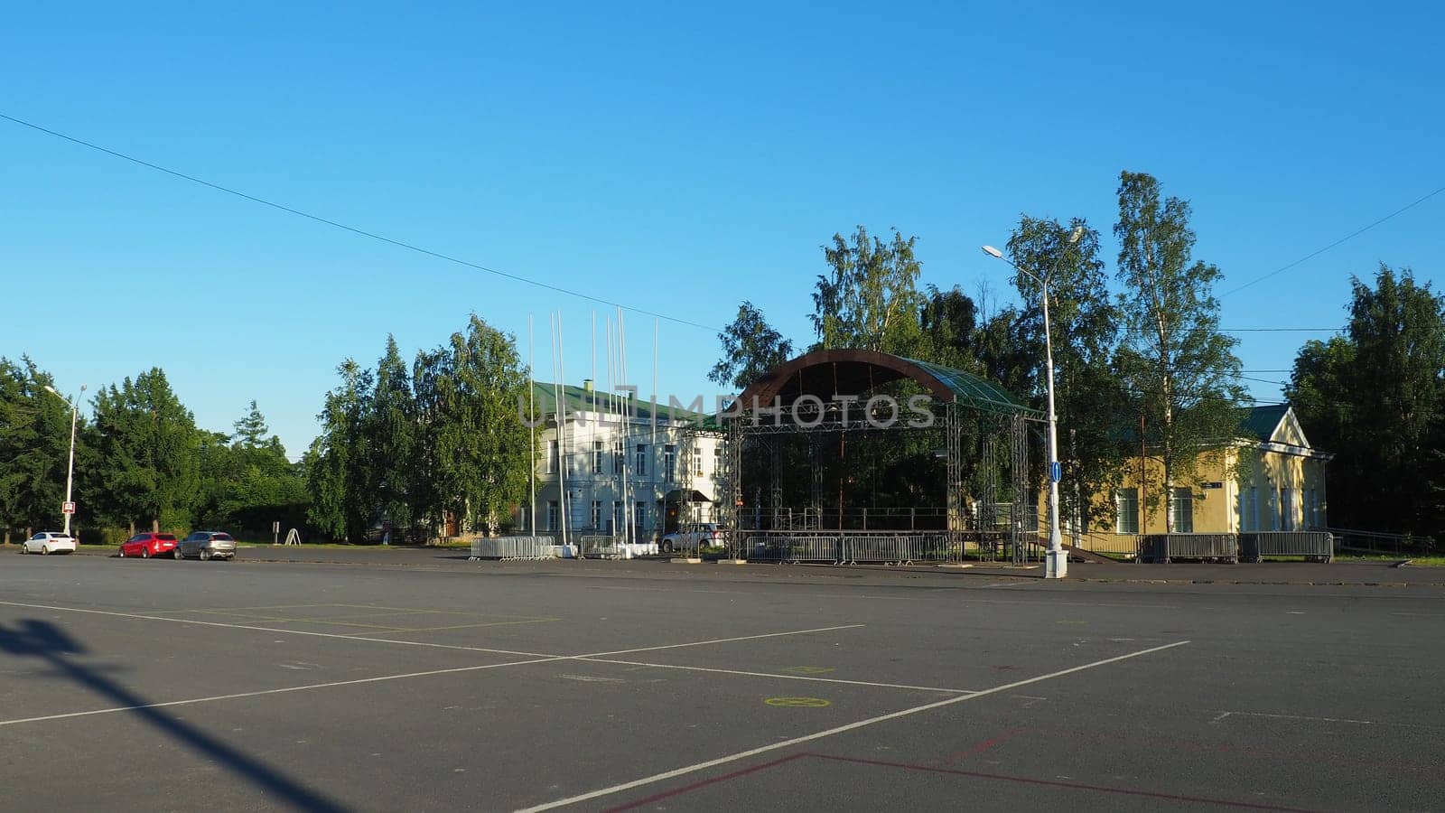 Petrozavodsk, Karelia, August 3, 2022 Kirov Square. Cars and passers-by. Children are rollerblading. Buildings of the city vocational school. Administration and depository of the Kizhi Museum-Reserve.