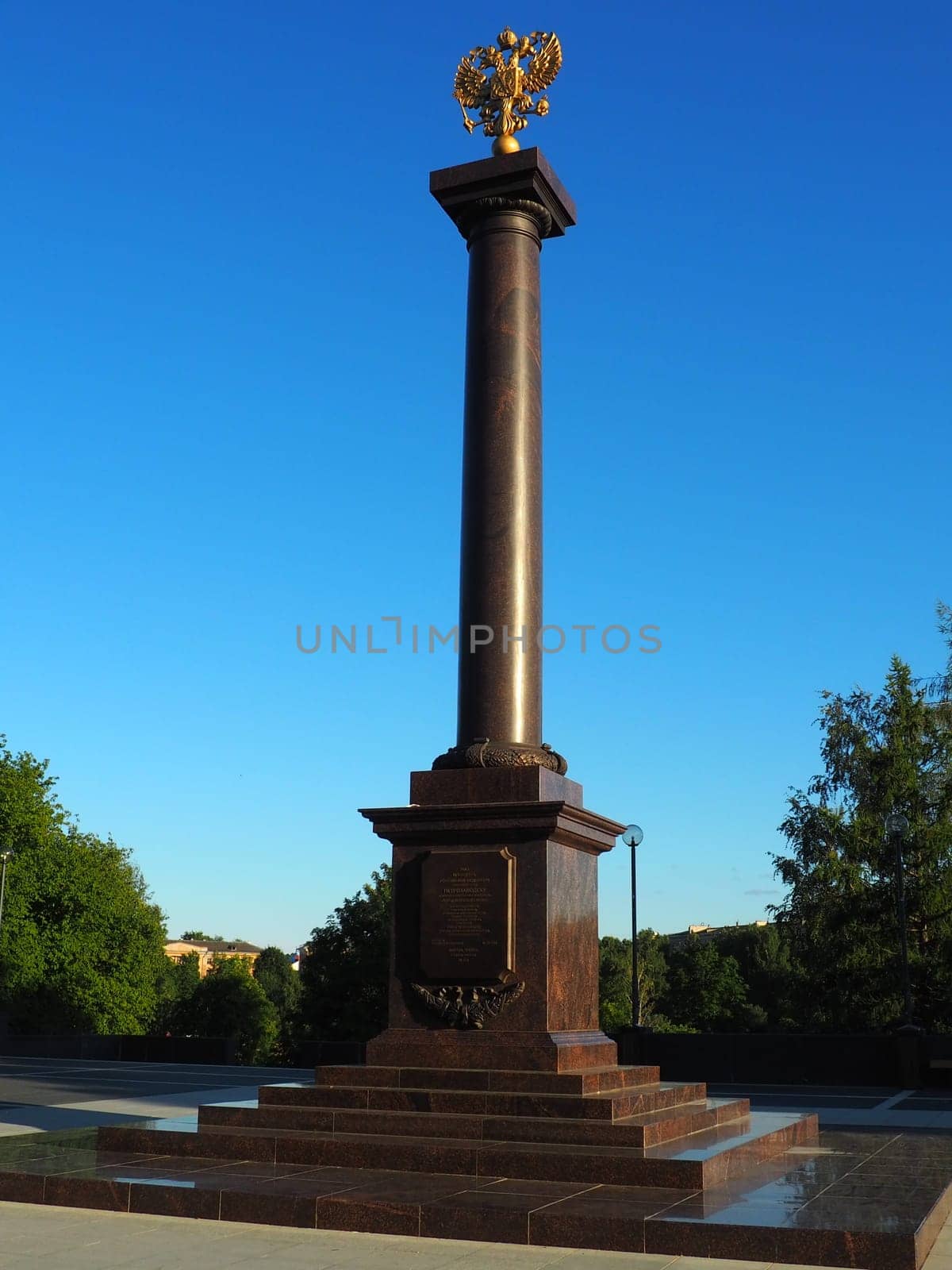 Petrozavodsk, Karelia, August 3, 2022 Monument-stele City of military glory, honorary title. Granite column with a bronze double-headed eagle. Pedestal on the alley of sister cities, Kirov Square.