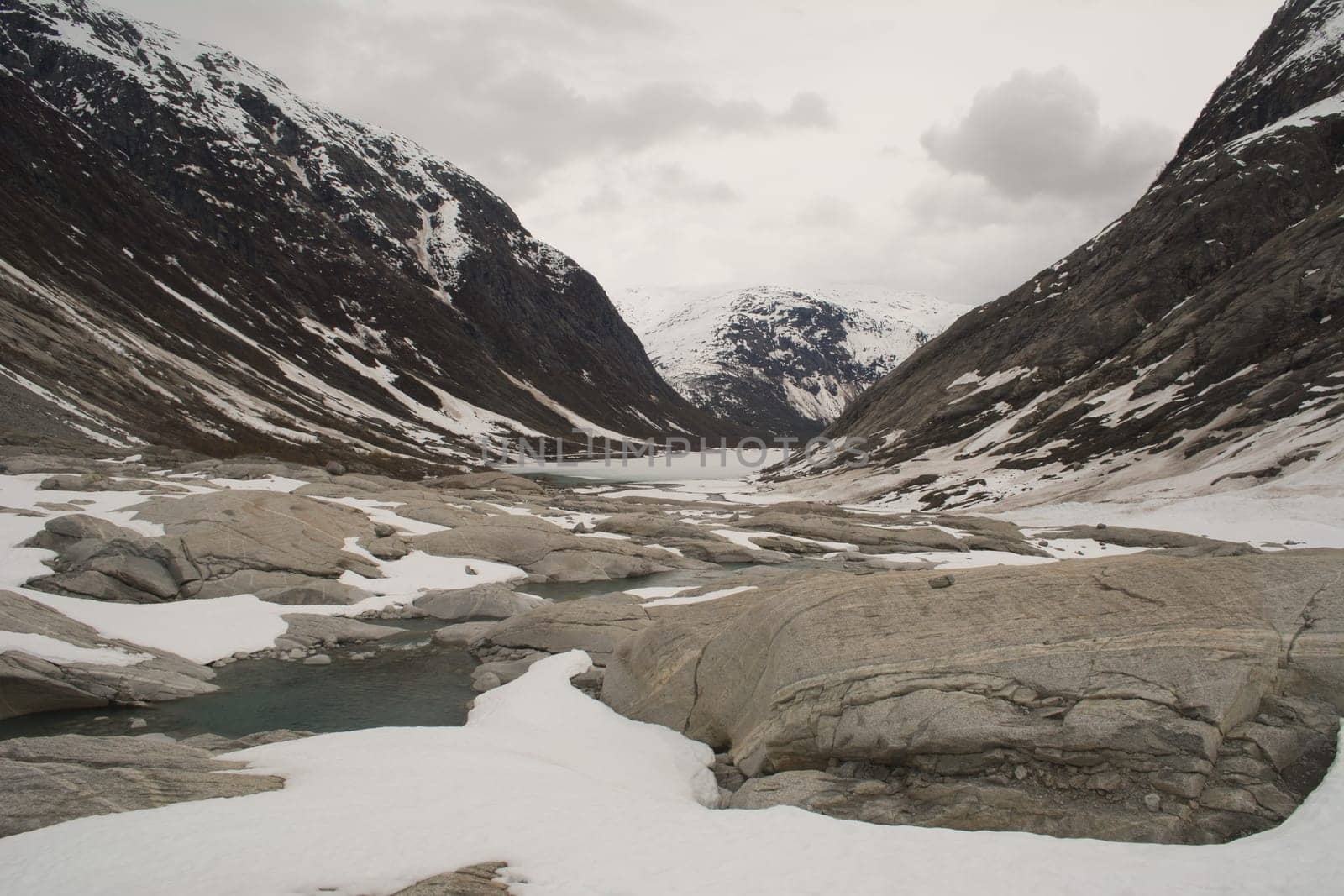 Glacier landscape with ice and rocks in Norway, illustrating retreating ice due to climate change. Beauty in nature.