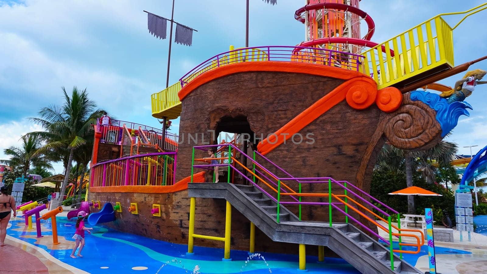 Coco Cay, Bahamas - April 29, 2022: People having fun at aquapark at Cococay, the island at Bahamas, where guests can spend the day having fun.