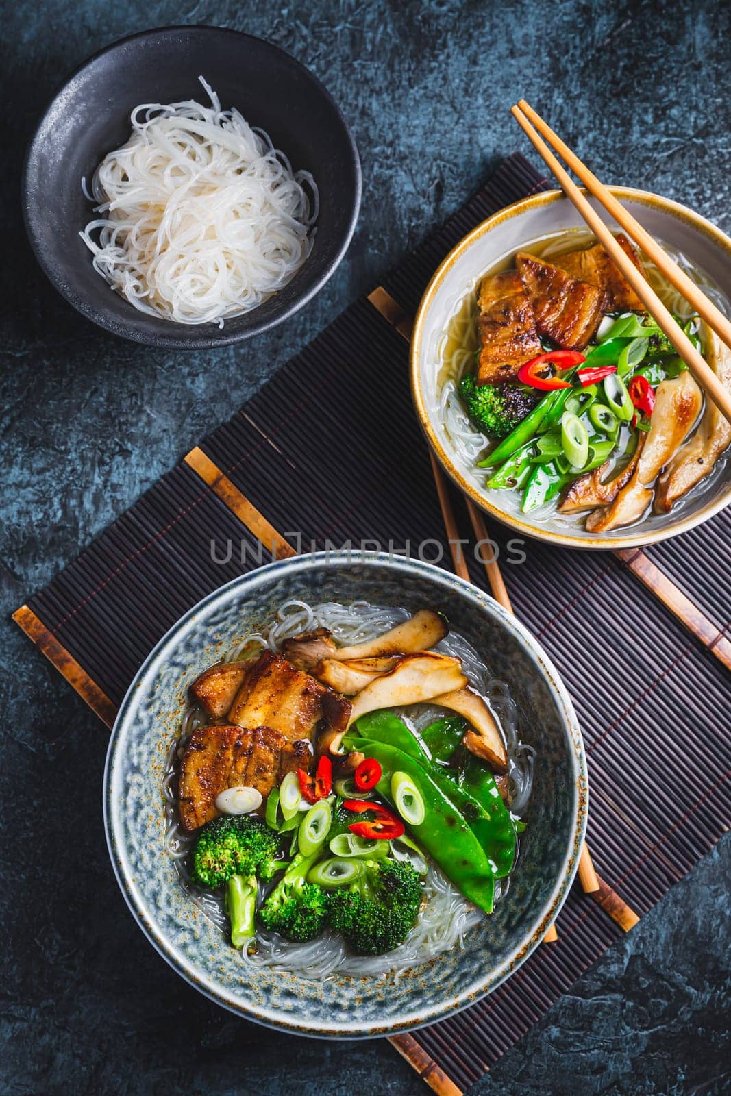 Ramen soup with mushrooms, vegetables, glass noodles and pork