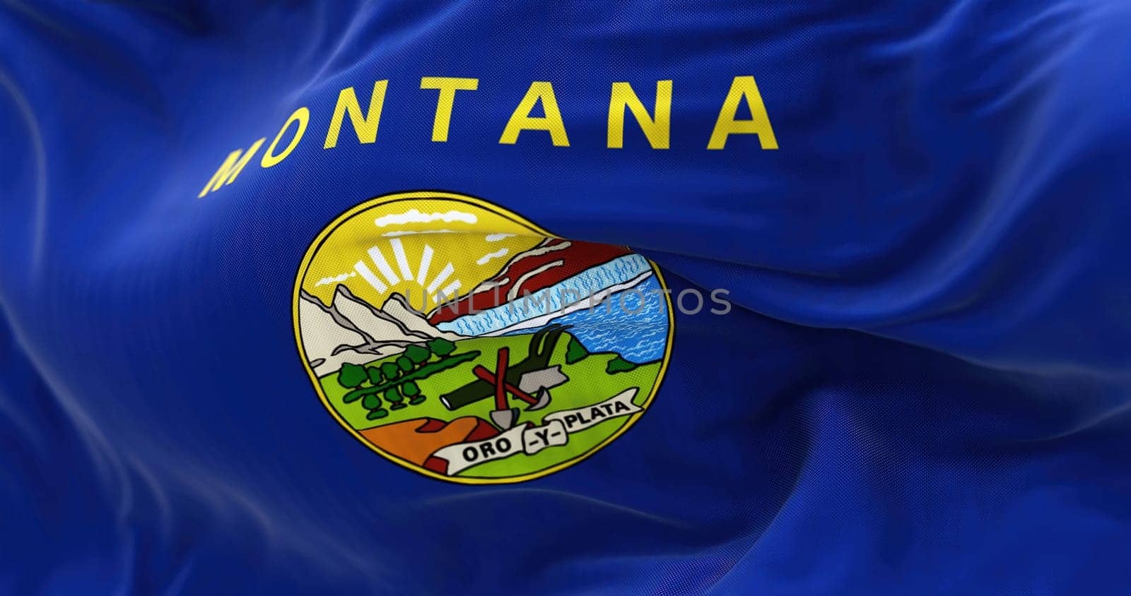Perspective view of the flag of the American state of Montana waving. Blue flag with coat of arms in the center. Fluttering fabric. Selective focus. Realistic 3d illustration. Close-up.
