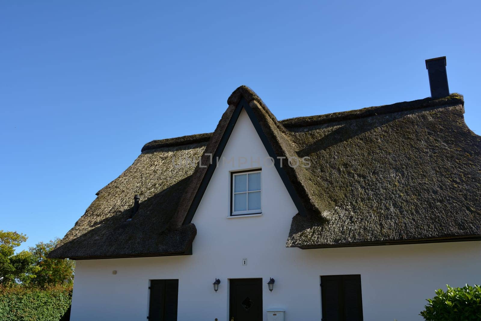 House with thatched roof on the Baltic Sea near Timmendorf Strand, Germany, Europe